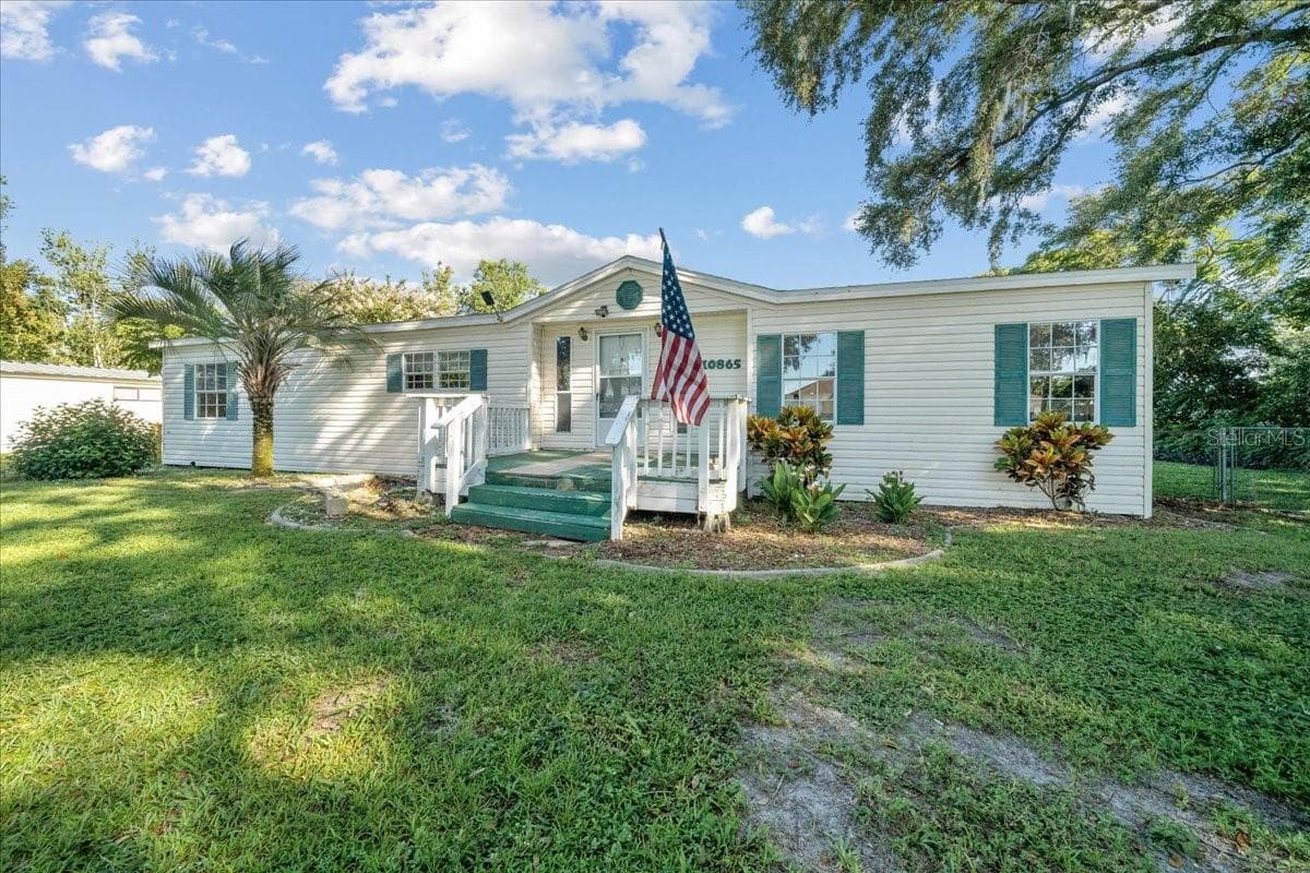 Manufactured Home at 10865 SE TIMUCUAN RD, SUMMERFIELD, photo 2 of 35