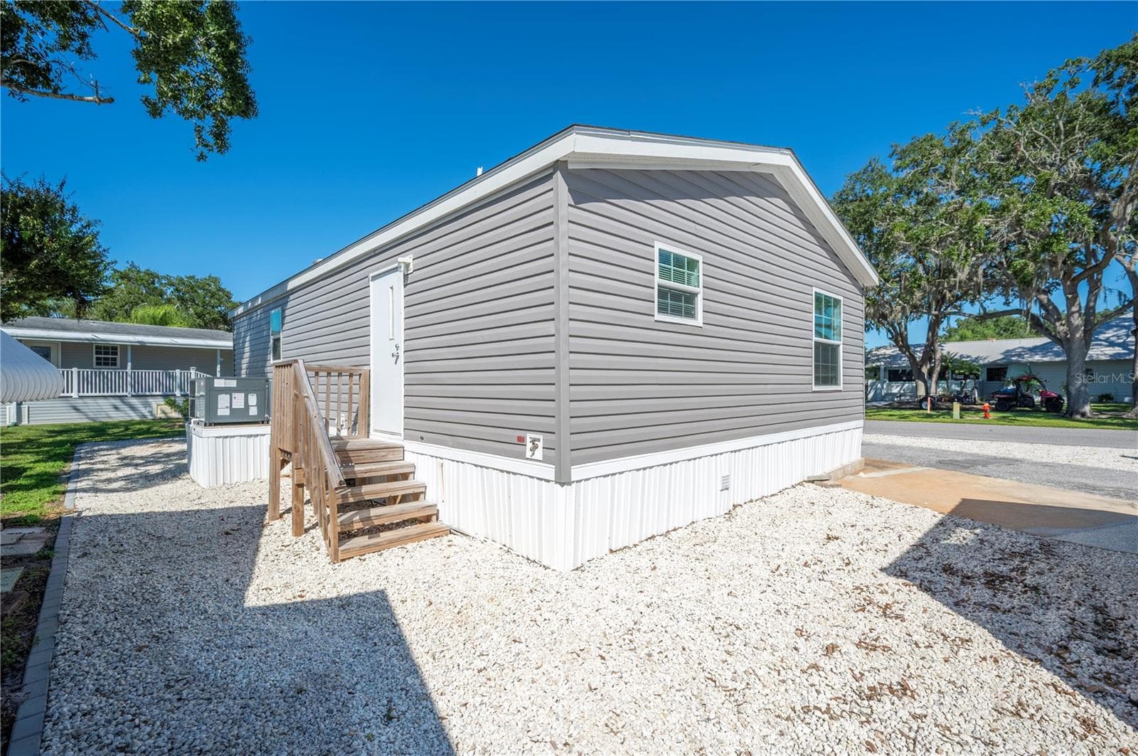 Rear patio stairs to side yard - 1 BEAVERKILL DR, LAKE WALES