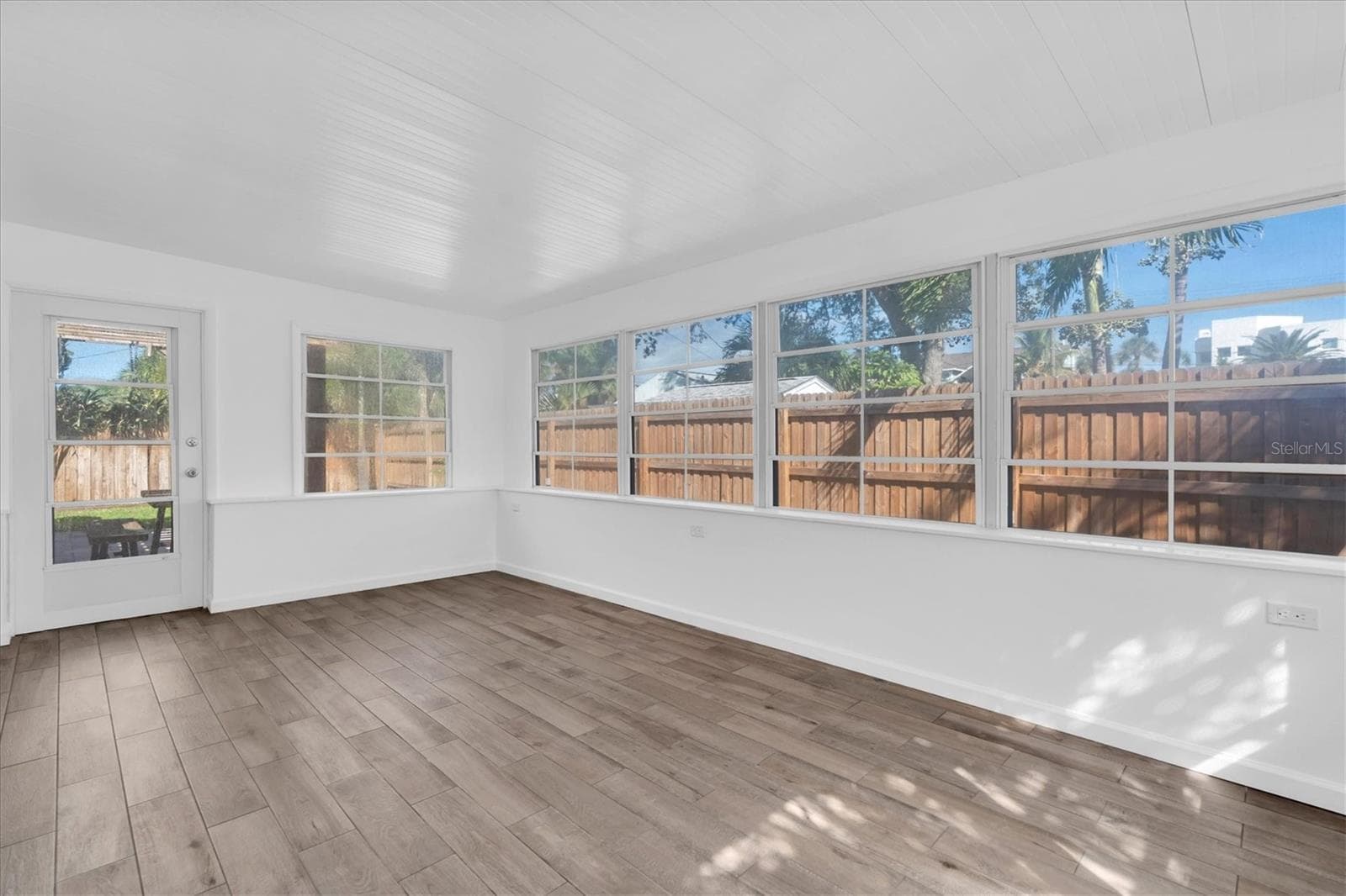 Enclosed Sunroom with Yard Access - 197 LIDO DR, ST PETE BEACH
