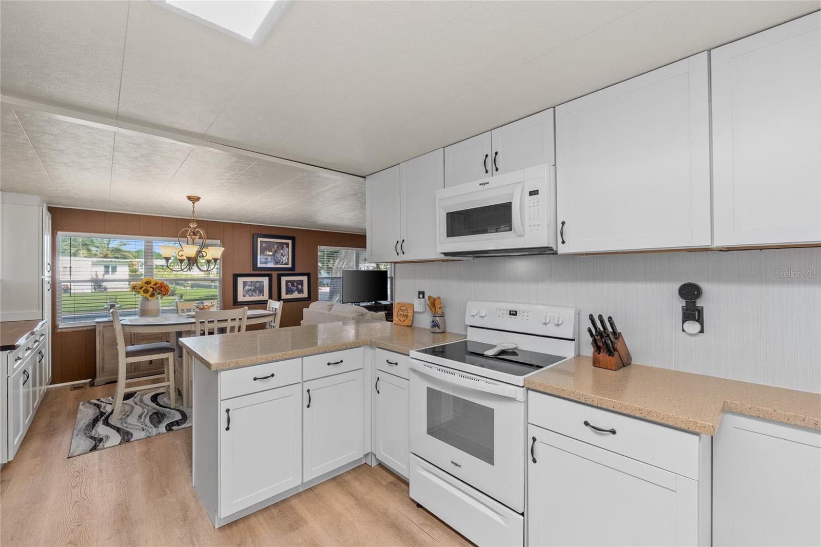 UPDATED KITCHEN WITH CORIAN COUNTERTOPS & WHIRLPOOL APPLIANCES (2021) and lots of storage - 288 SALEM AVE #3, PALM HARBOR