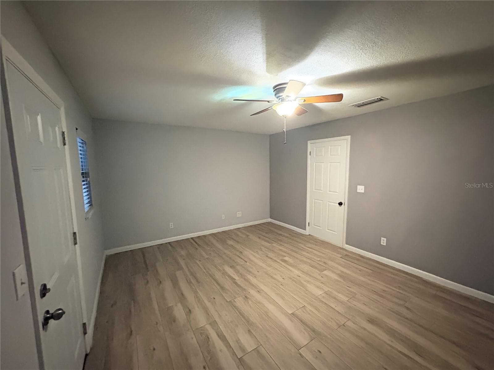 Bedroom 2 with Door to Backyard - 1722 NW 35 ST, OCALA