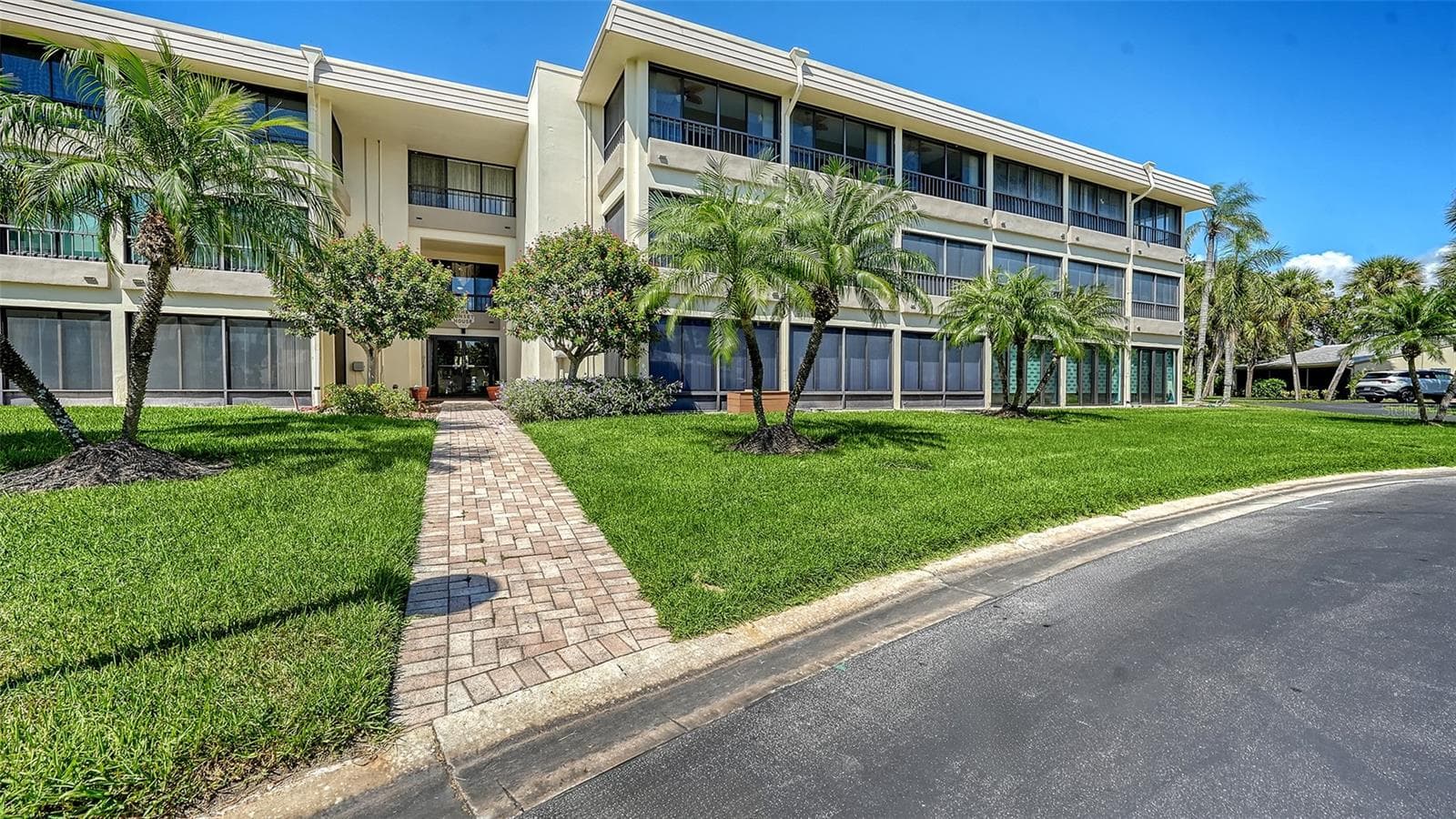 The entrance to 225 Hourglass Way, known as the Sunset House building. - 225 HOURGLASS WAY #103, SARASOTA