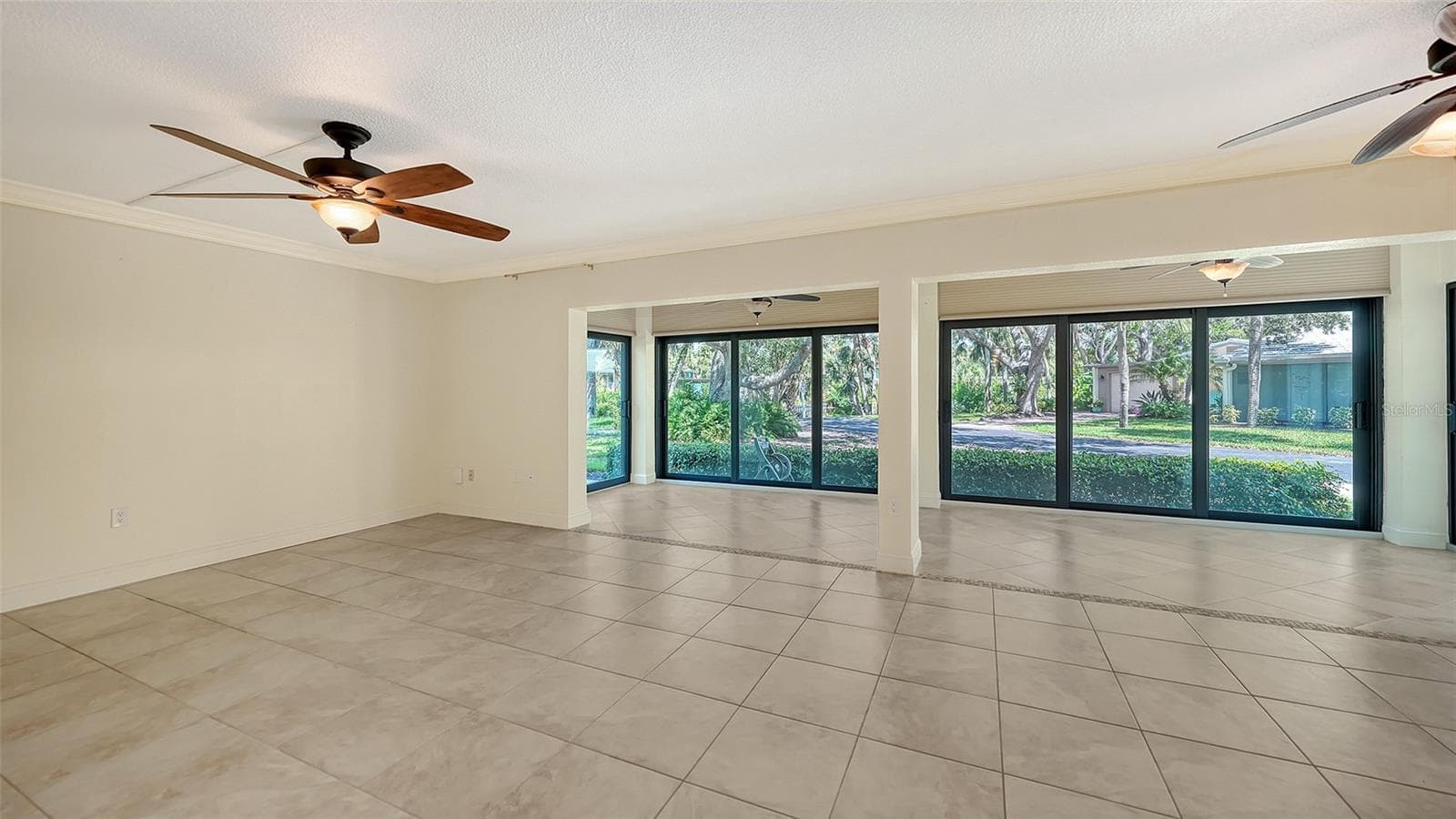 Living room. All sliders in this unit are Miami-Dade hurricane rated. - 225 HOURGLASS WAY #103, SARASOTA