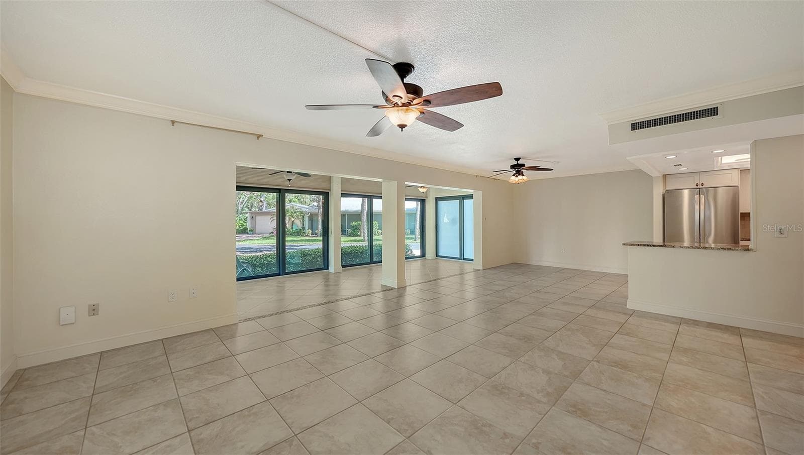 Open concept floor plan. Kitchen to the right. - 225 HOURGLASS WAY #103, SARASOTA