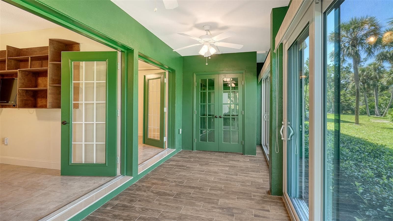 French doors open from both bedrooms into the lagoon facing lanai. - 225 HOURGLASS WAY #103, SARASOTA