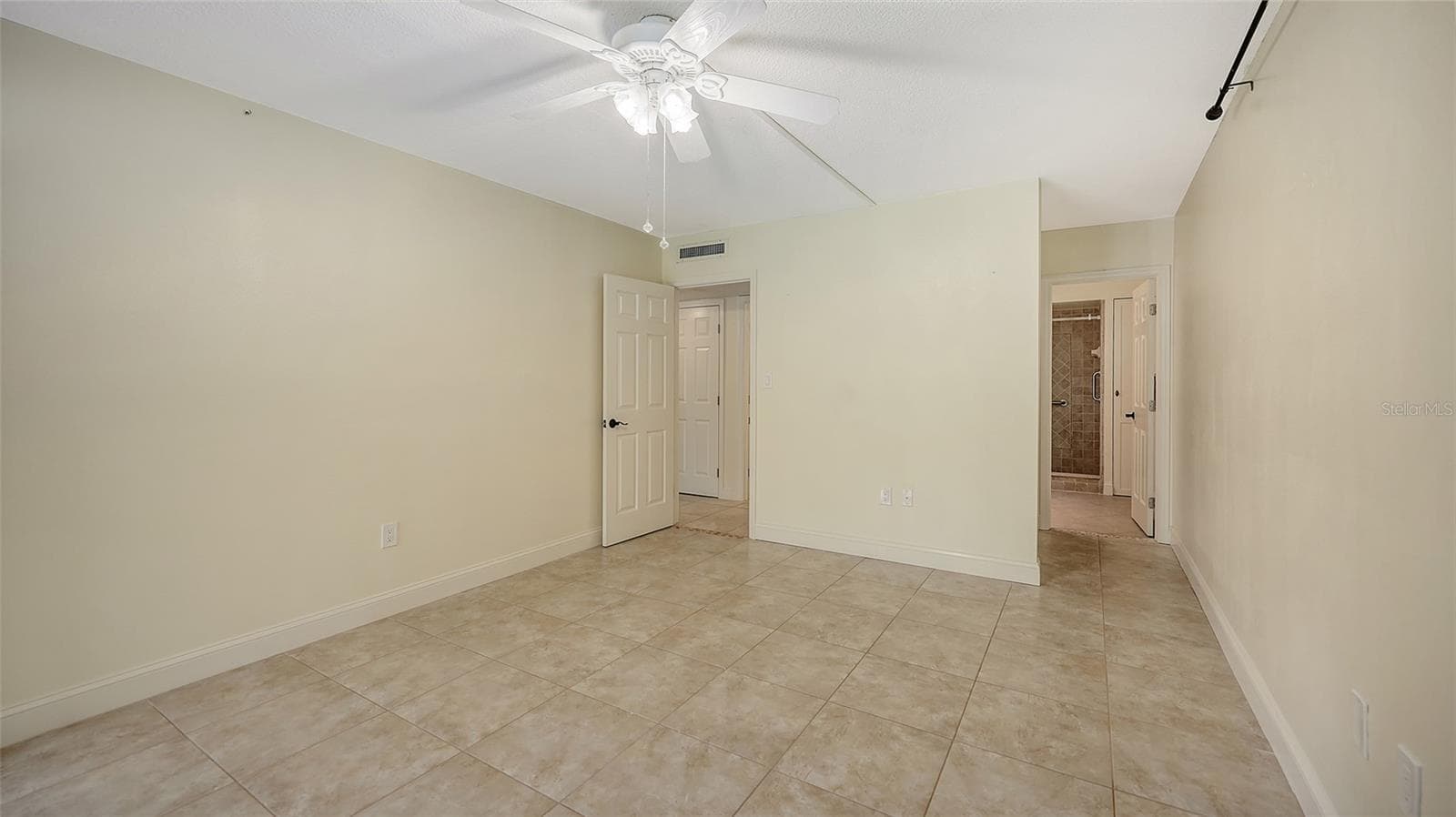 Looking back into the primary bedroom from the lanai. - 225 HOURGLASS WAY #103, SARASOTA