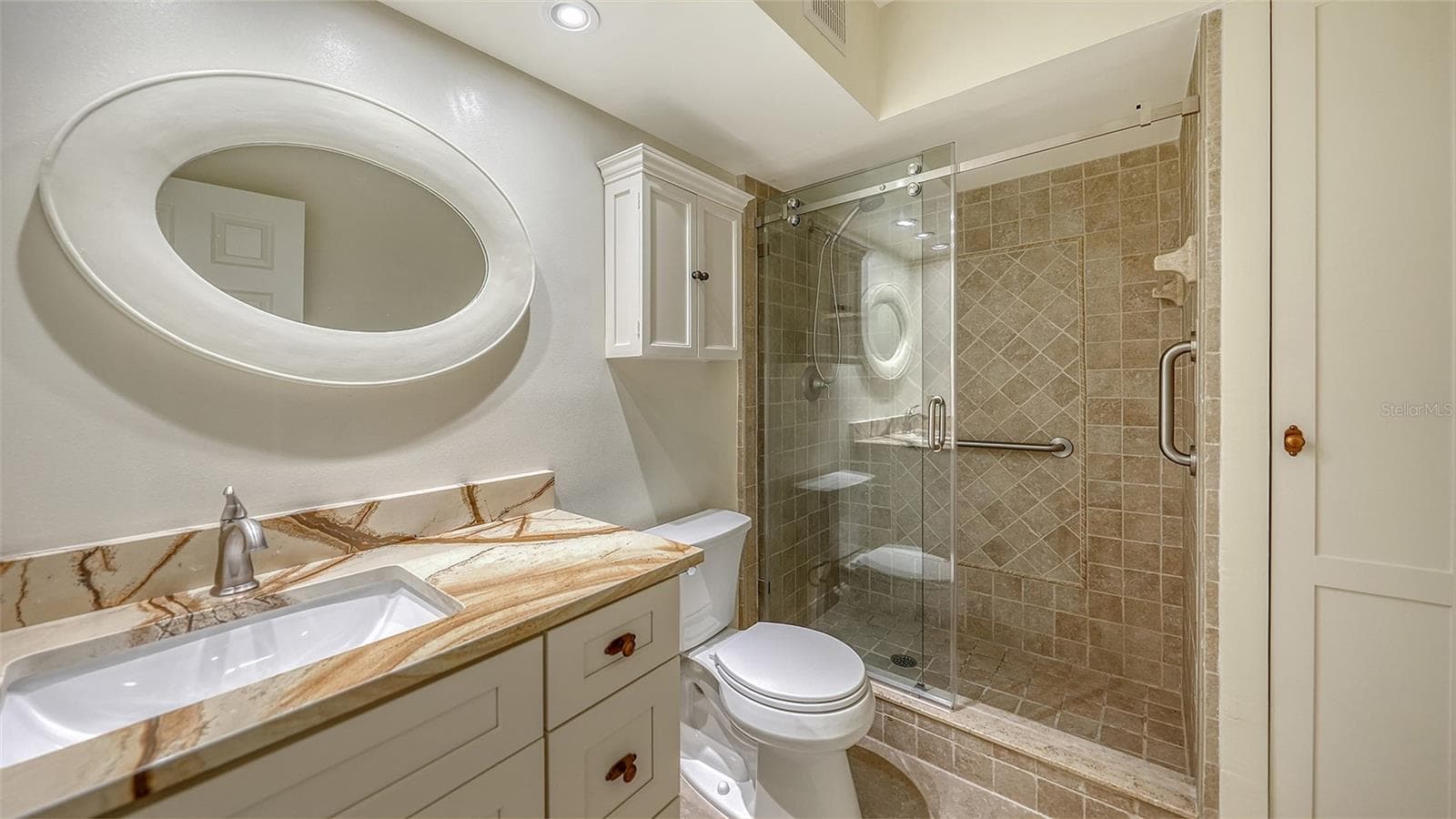 Updated primary bathroom with granite counters, new fixtures, & soft close cabinetry. - 225 HOURGLASS WAY #103, SARASOTA