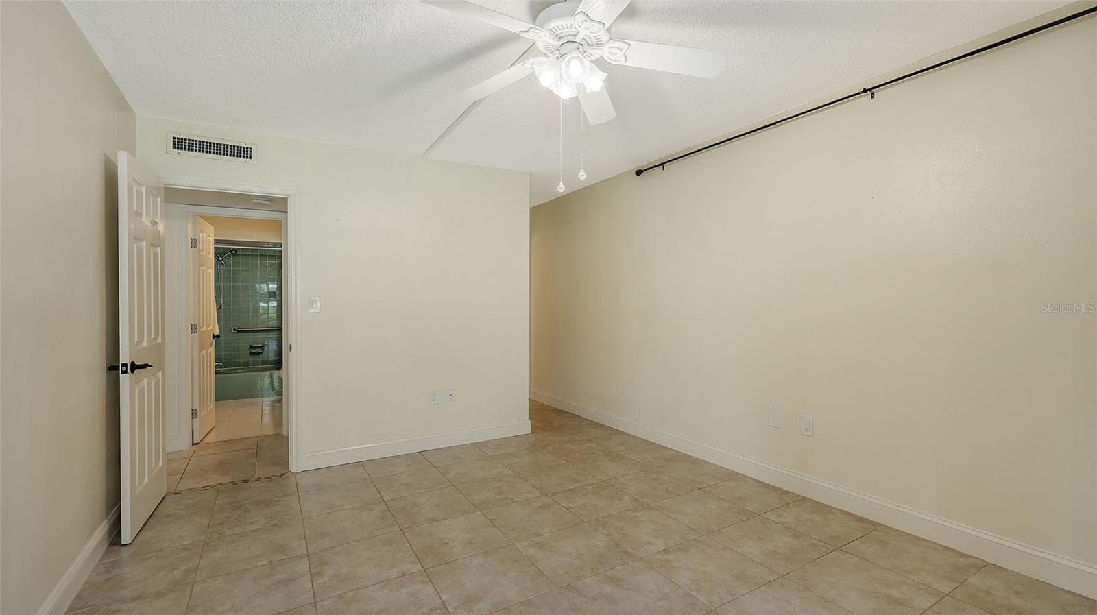 Leaving the primary bedroom. - 225 HOURGLASS WAY #103, SARASOTA