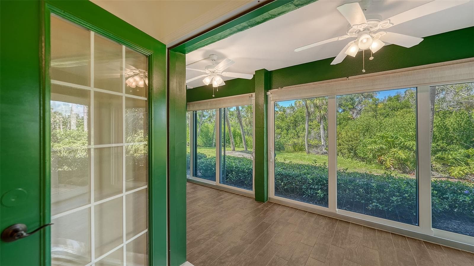 A set of French doors opens to the lagoon facing lanai. - 225 HOURGLASS WAY #103, SARASOTA
