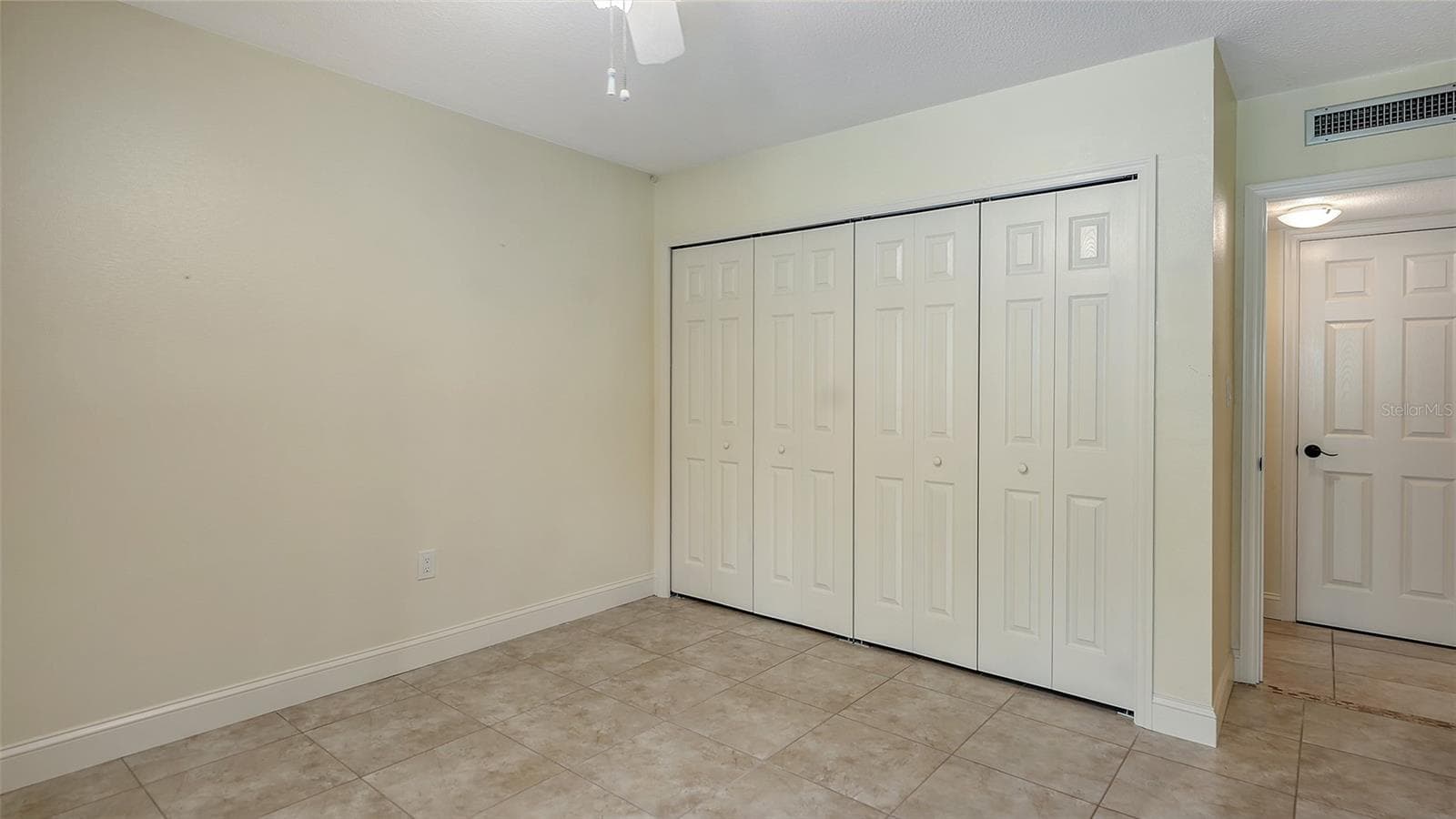Guest bedroom features two built-in closets. - 225 HOURGLASS WAY #103, SARASOTA