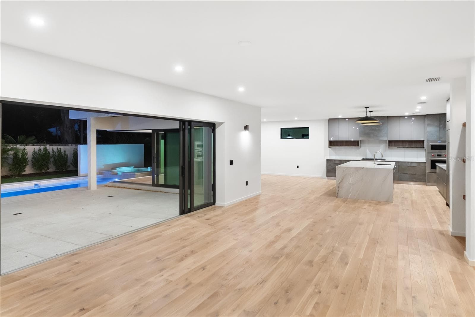Open-concept design with seamless indoor–outdoor living. - 1759 WALDEMERE ST, SARASOTA
