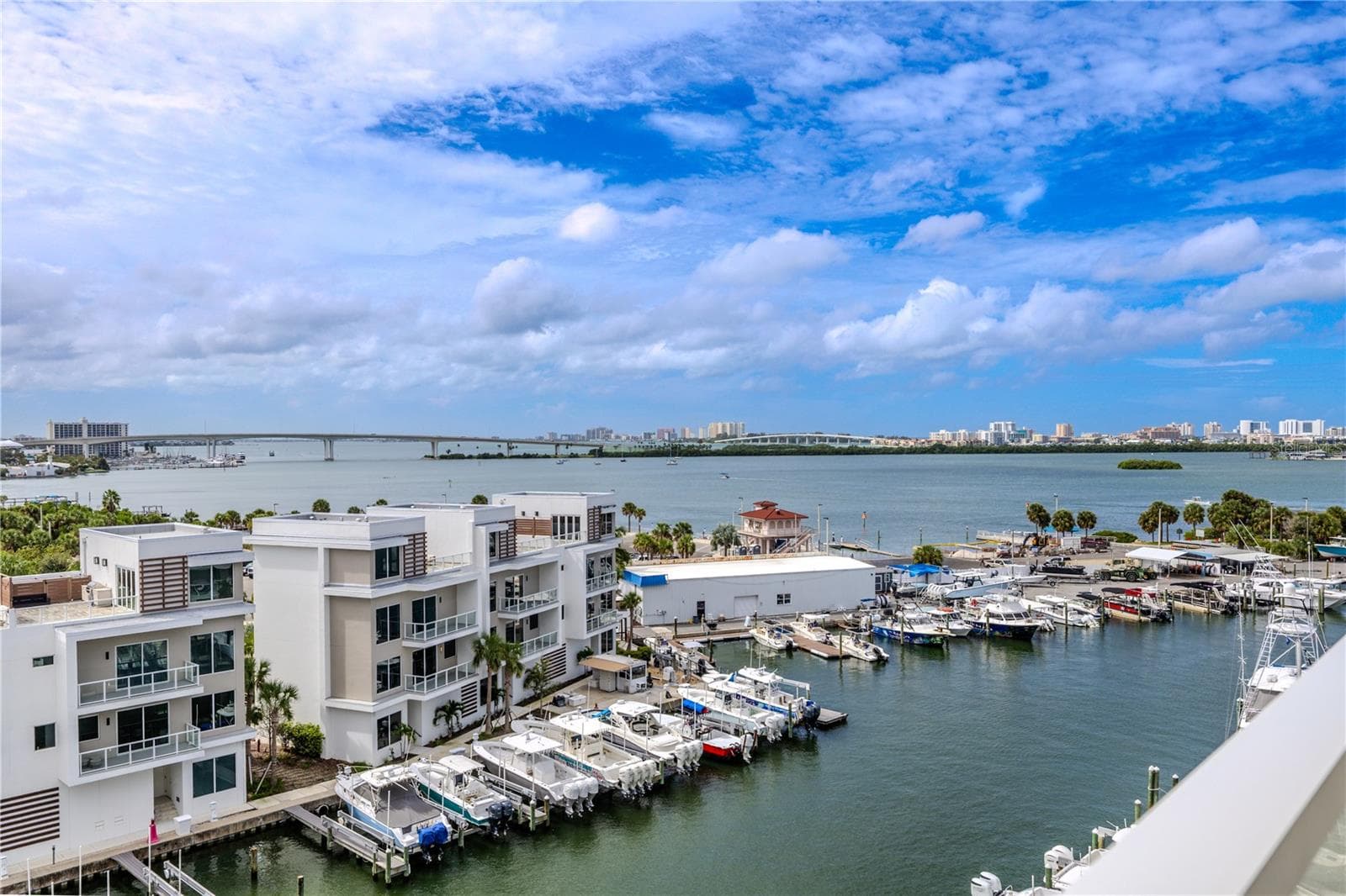 Overlooking the Intracoastal Waterway and marina, this outdoor retreat captures both the Memorial Causeway and Sand Key Bridge—each glowing beautifully at night. - 920 N OSCEOLA AVE #703, CLEARWATER