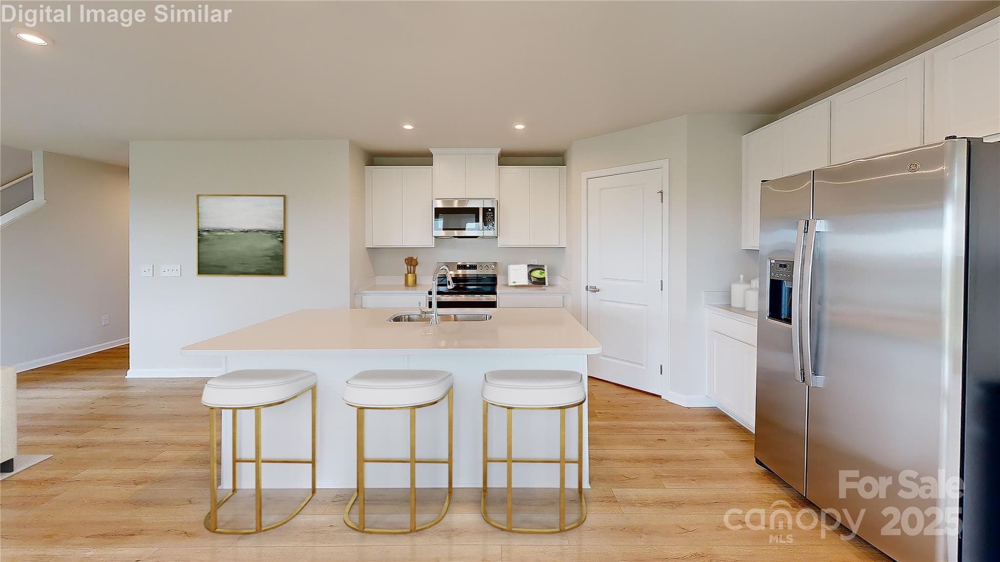 The heart of the home shines in this open-concept kitchen! A spacious island seats three—perfect for casual meals or catching up. Sleek appliances, generous counter space, and a layout built for cooking and connection make this space stylish, smart, and inviting. - 1280 Elm Forest Lane, China Grove