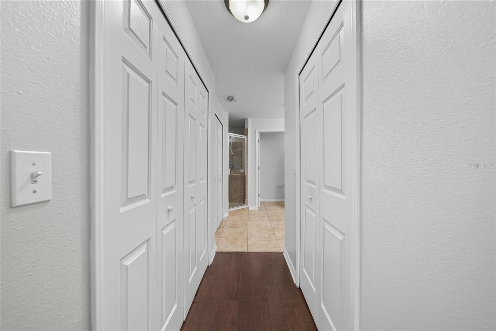 entrance to primary bathroom with 2 walk-in closets - 9427 ROLLING CIR, SAN ANTONIO