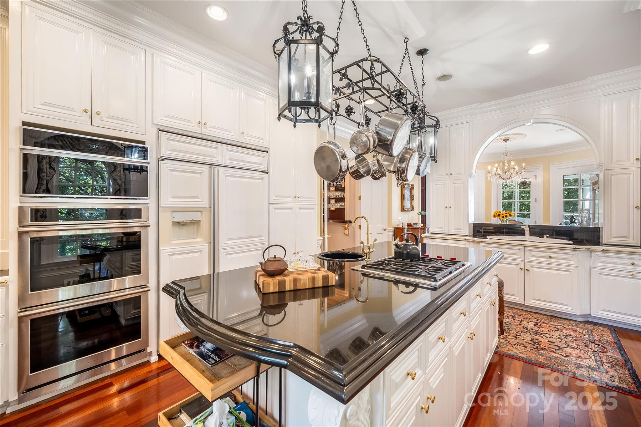 High end appliances, a central island and tons of pantry and counter space. Informal dining and wet bar are just a step away. - 2665 Rolling Hills Drive, Monroe