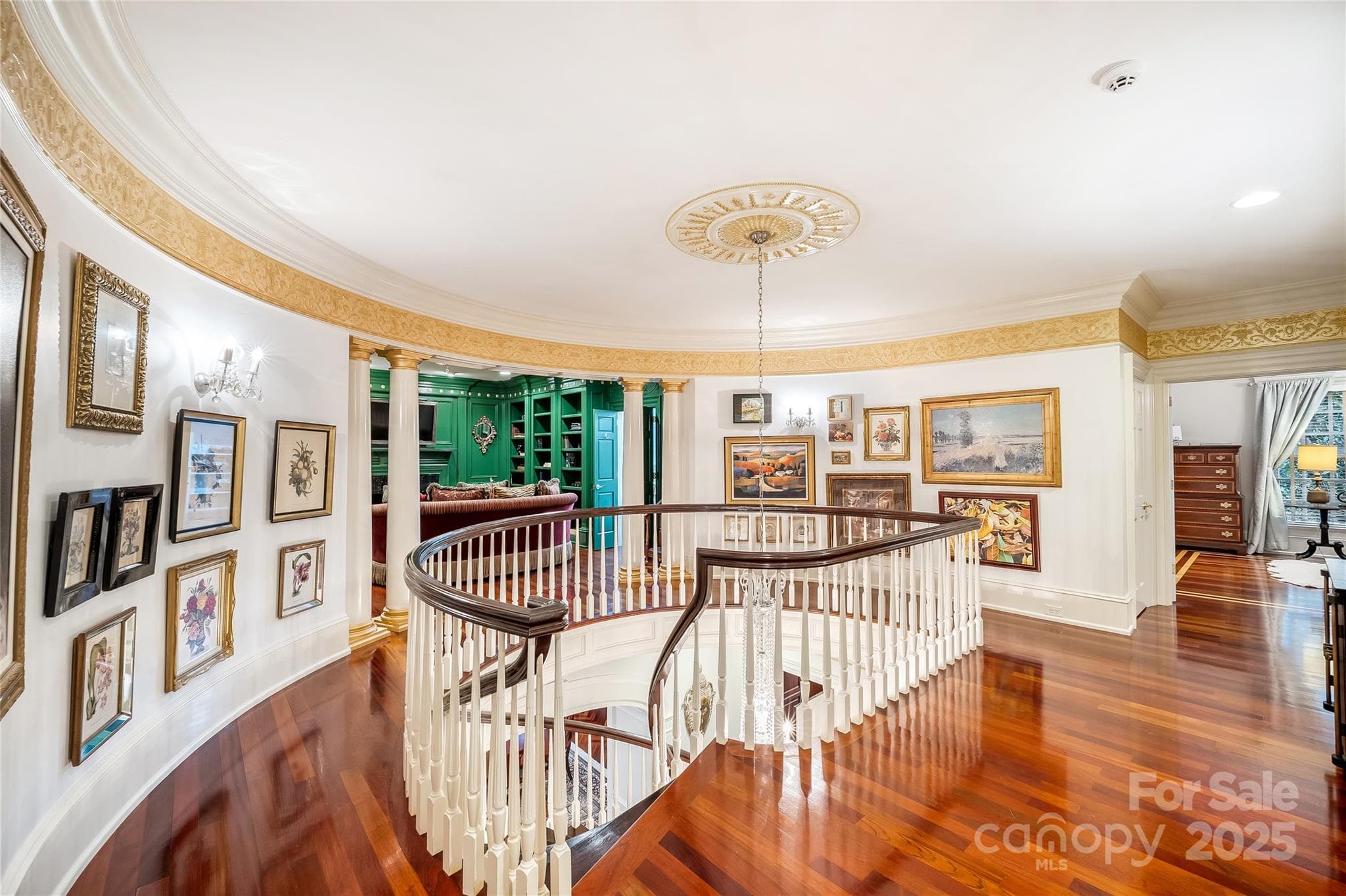 Art lined rotunda with private den/library divides the two suites on the second level. - 2665 Rolling Hills Drive, Monroe