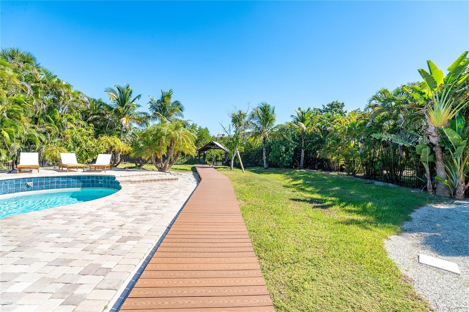 Backyard and Walkway to Dock. - 260 KETTLE HARBOR DR, PLACIDA