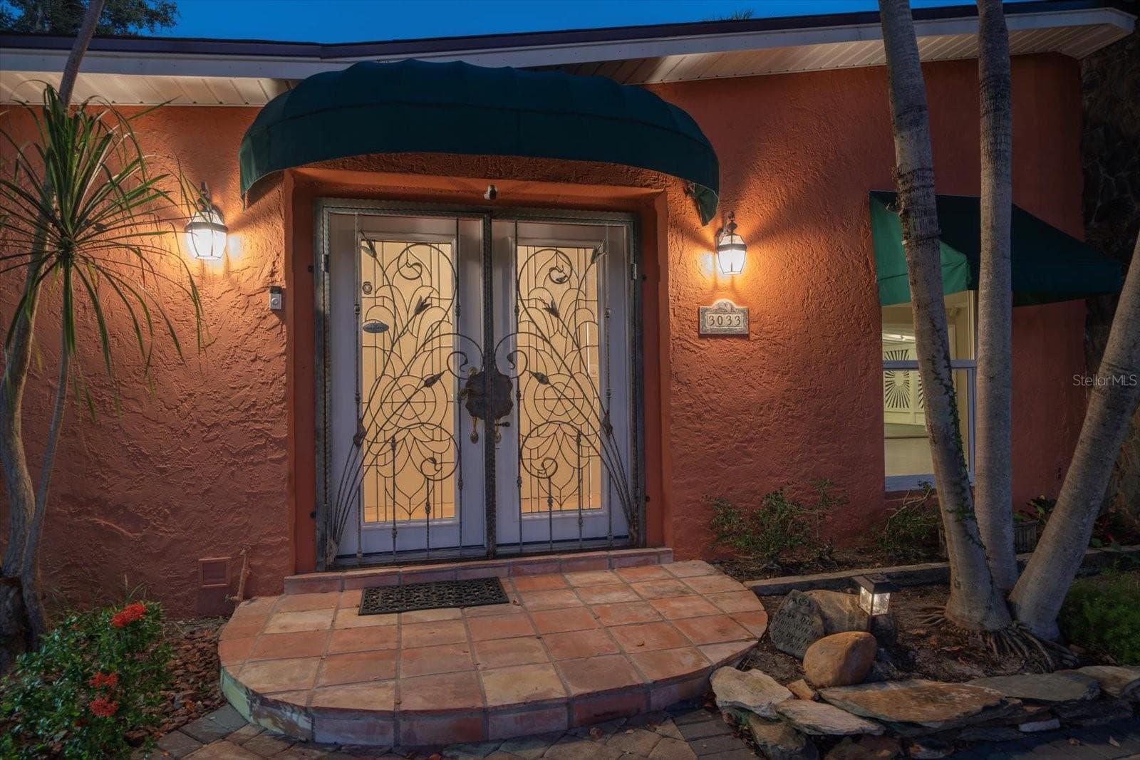 CUSTOM WROUGHT IRON - DOUBLE LEADED GLASS DOOR COVERED ENTRY WAY WITH STONE PAVER PORCH - 3033 82ND WAY N, ST PETERSBURG