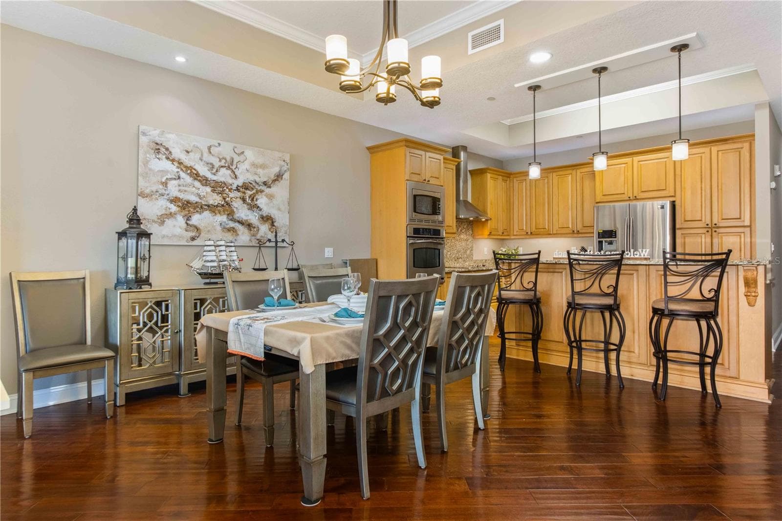 DINING AREA IN BETWEEN LIVING AND KITCHEN - 202 WINDWARD PSGE #603, CLEARWATER BEACH