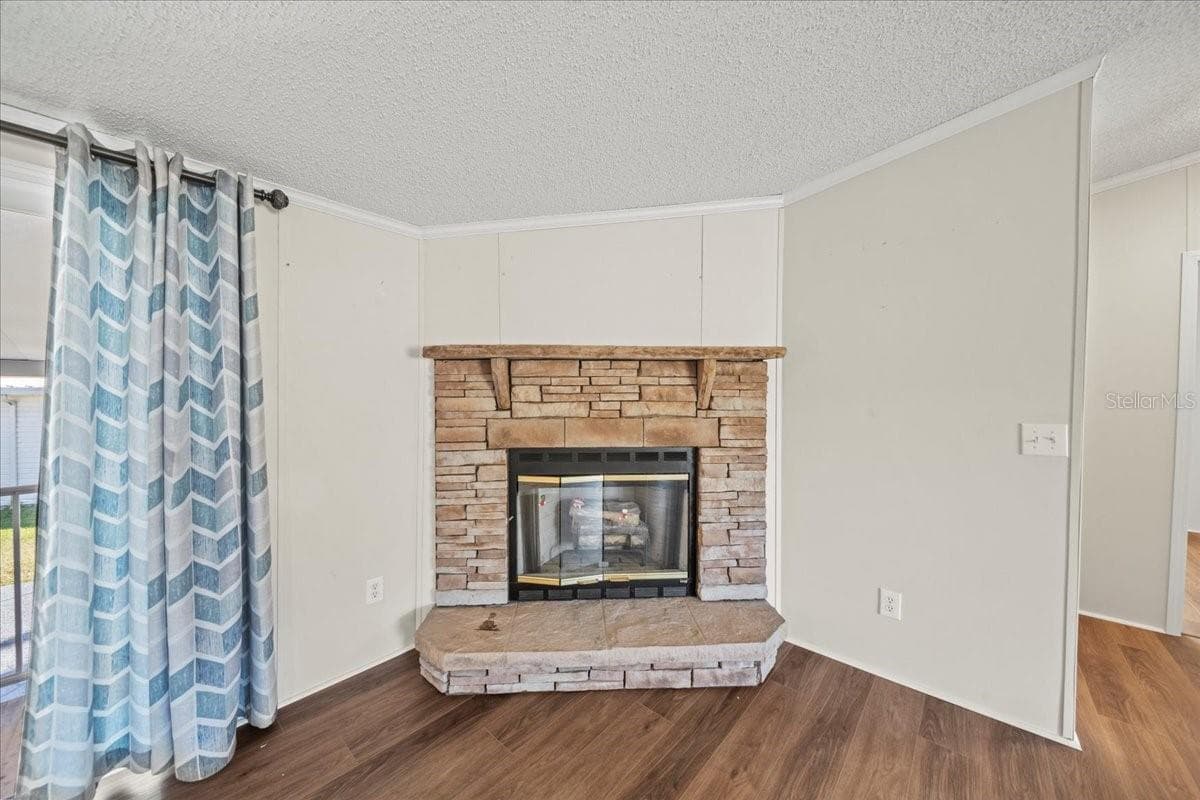 Living room features a fireplace - 101 EDGEWOOD BLVD, LAKE WALES