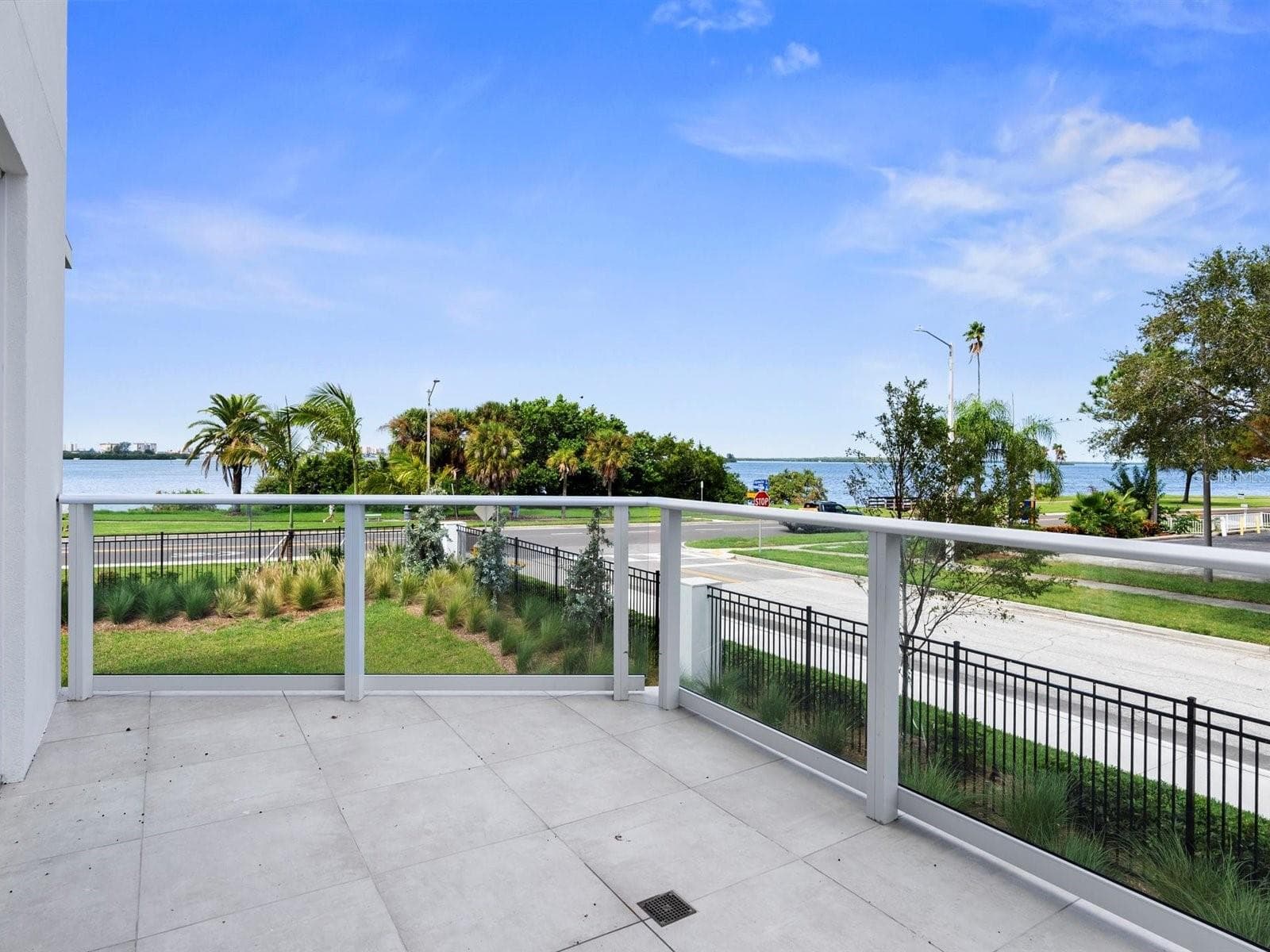 North Private Terrace with additional water view - 1020 SUNSET POINT RD #103, CLEARWATER
