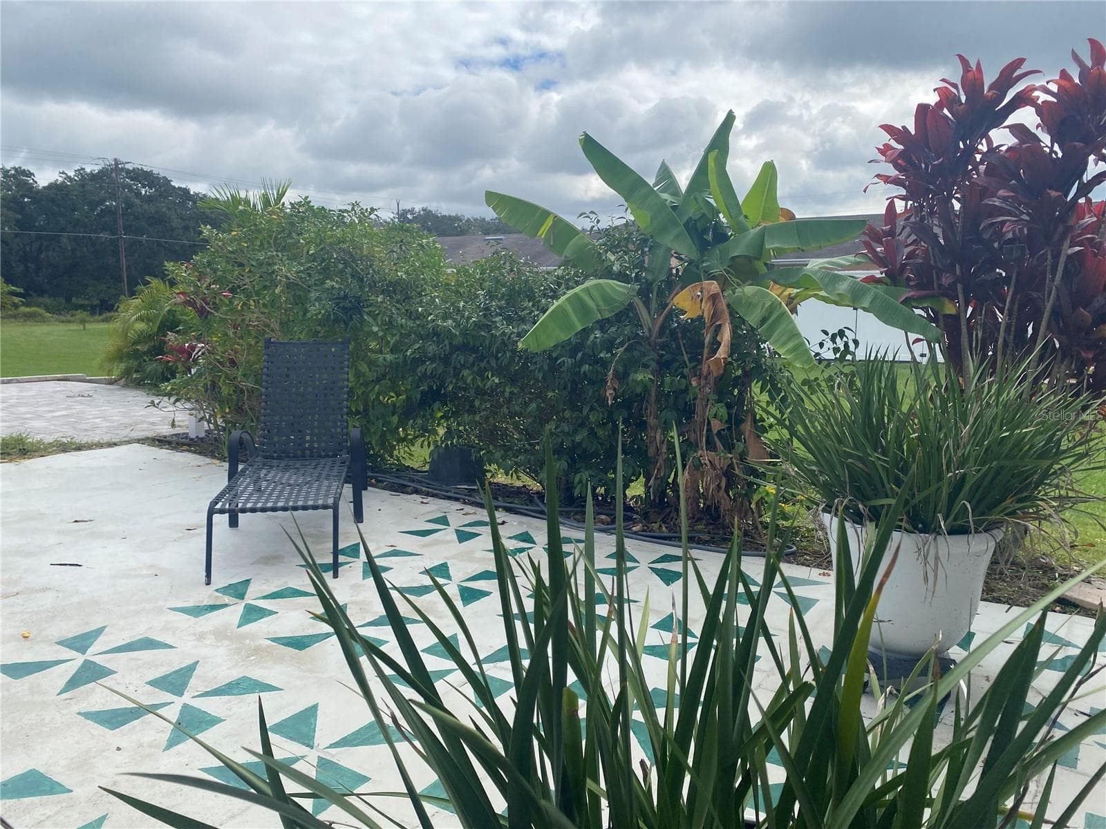 You’ll also love the private courtyard with a concrete patio and mature landscaping — an ideal spot for your morning coffee or evening glass of wine. - 4409 CLUB CIR, LAKE WALES