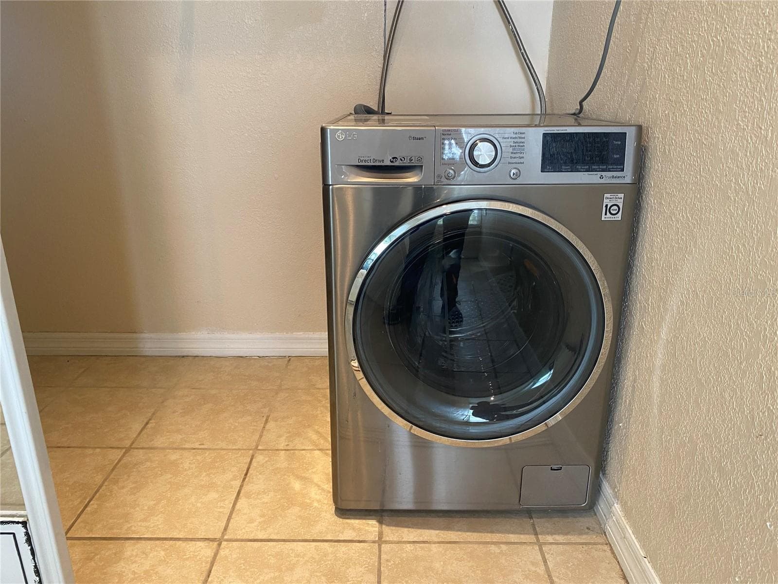 The combination washer/dryer appliance is located in the bedroom closet and will stay in the home and provides at home laundry instead of having to go to a laundromat. - 4409 CLUB CIR, LAKE WALES