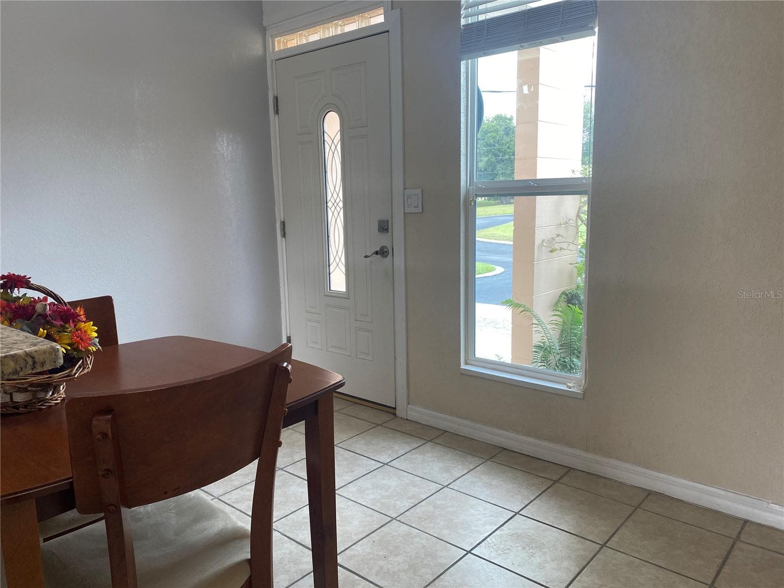 The front door has a lead glass insert and the home has new double pane windows. - 4409 CLUB CIR, LAKE WALES