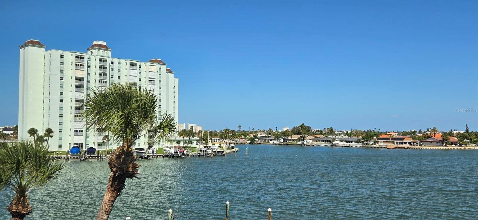 Florida room & primary bedroom bay view. - 6061 2ND ST E #55, ST PETE BEACH