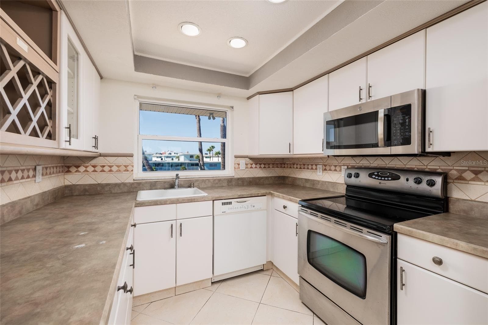Kitchen w/Courtyard views. - 6061 2ND ST E #55, ST PETE BEACH