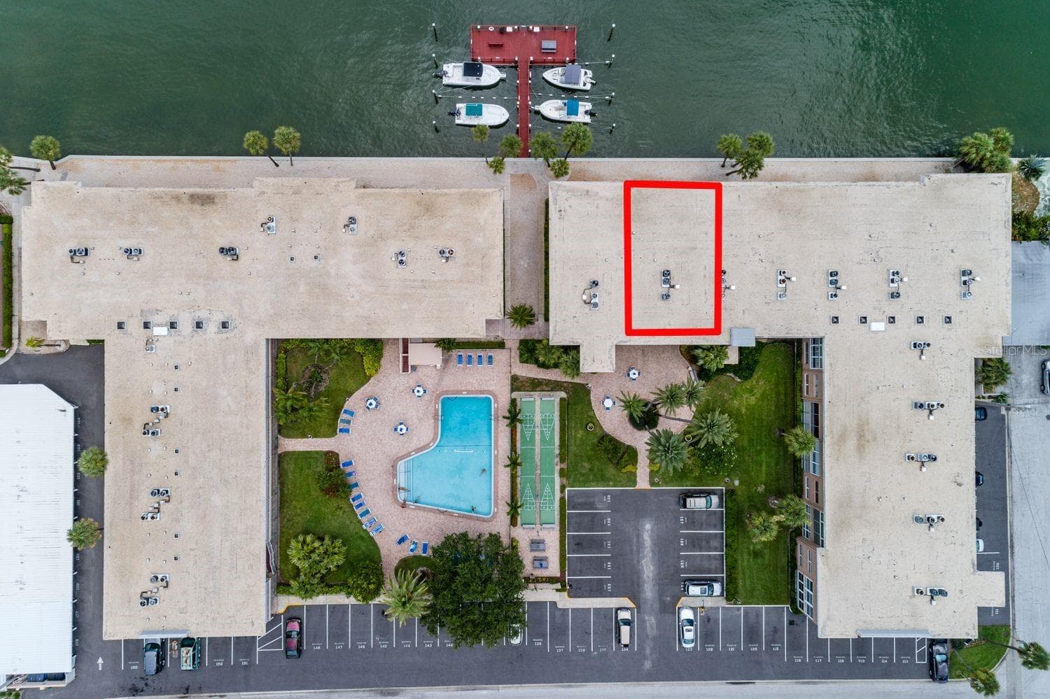 Unit, dock/Fishing pier, courtyard, pool (1 of 2) & shuffleboard/grilling area. - 6061 2ND ST E #55, ST PETE BEACH