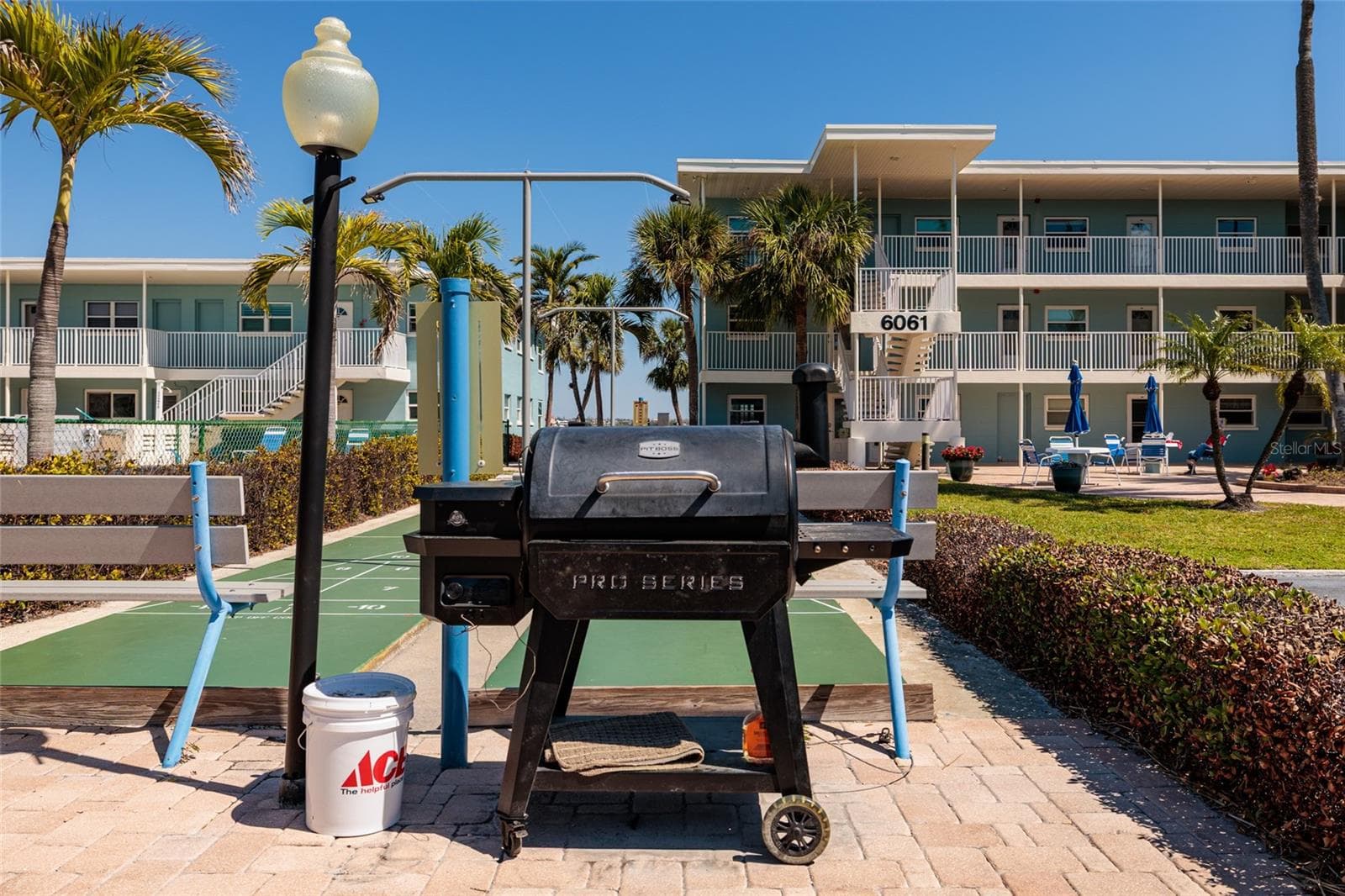 Grilling area just steps away from the unit. Also has 2 gas grills. - 6061 2ND ST E #55, ST PETE BEACH