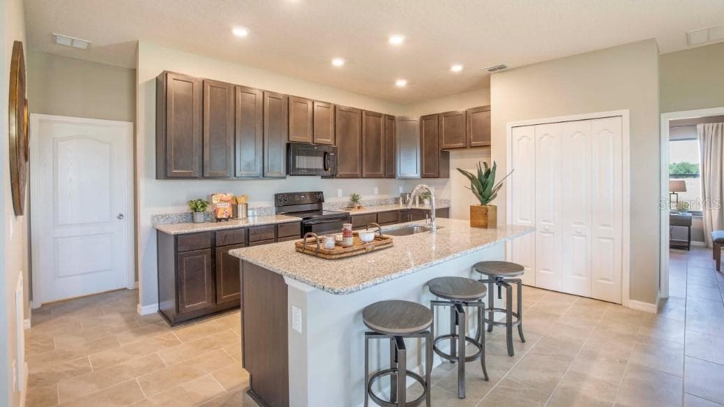 Model home - actual features may vary. - 808 SUNSHOWER DR, LADY LAKE