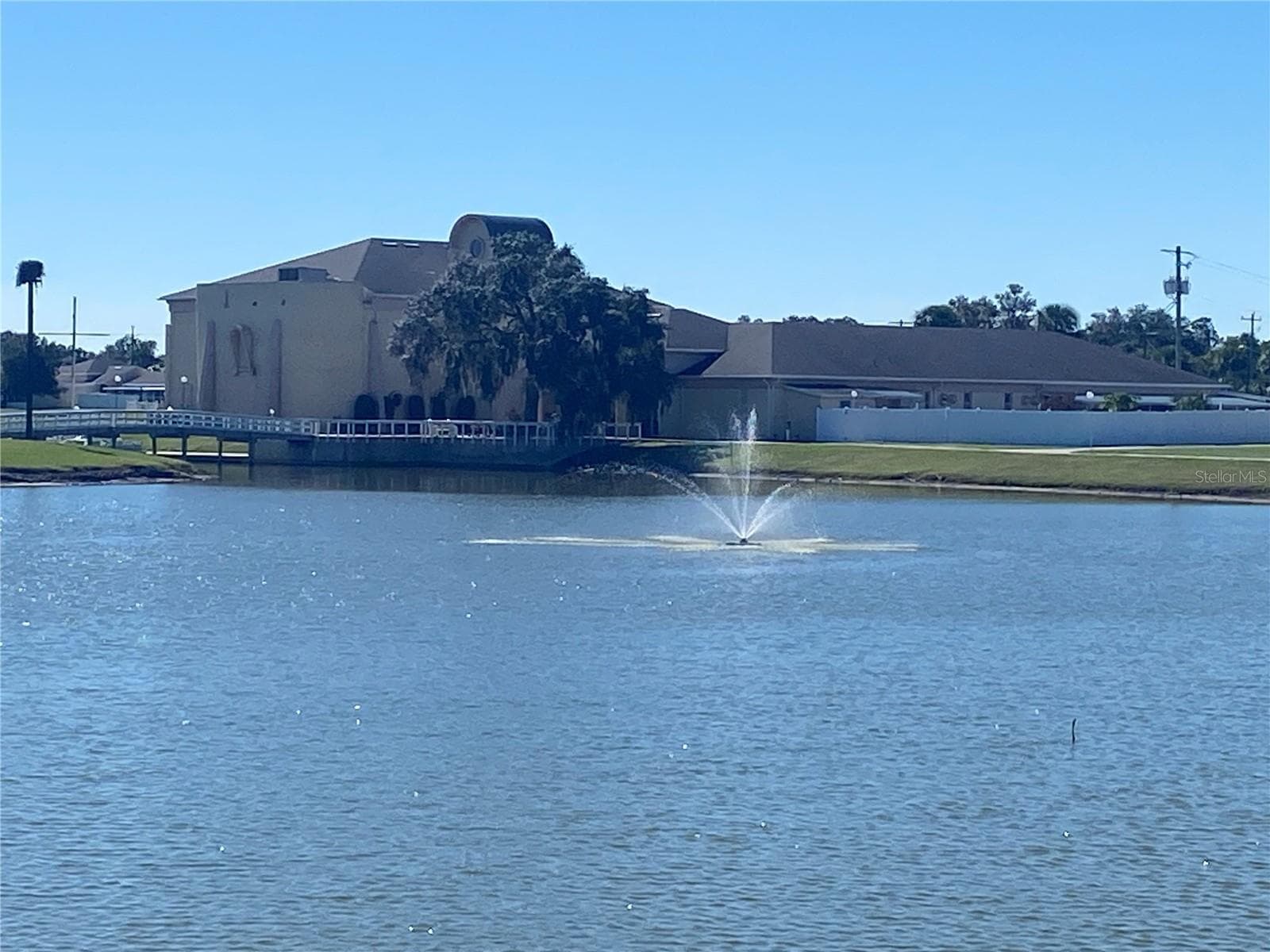 Taken from the walking path looking back to the clubhouse. Waterviews are always peaceful and relaxing. - 4409 CLUB CIR, LAKE WALES