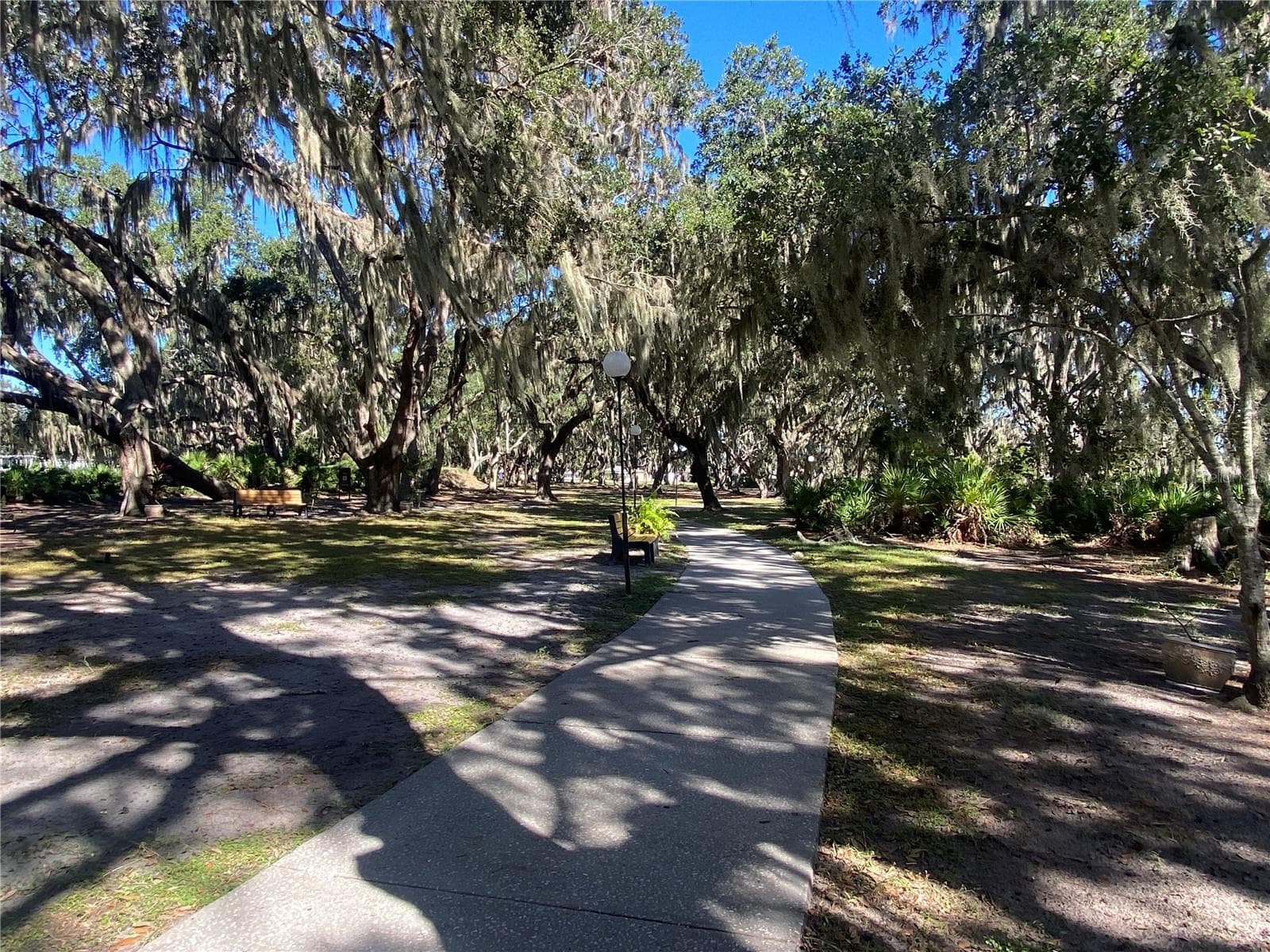 Concrete pathways make an easy walk to enjoy nature. - 4409 CLUB CIR, LAKE WALES