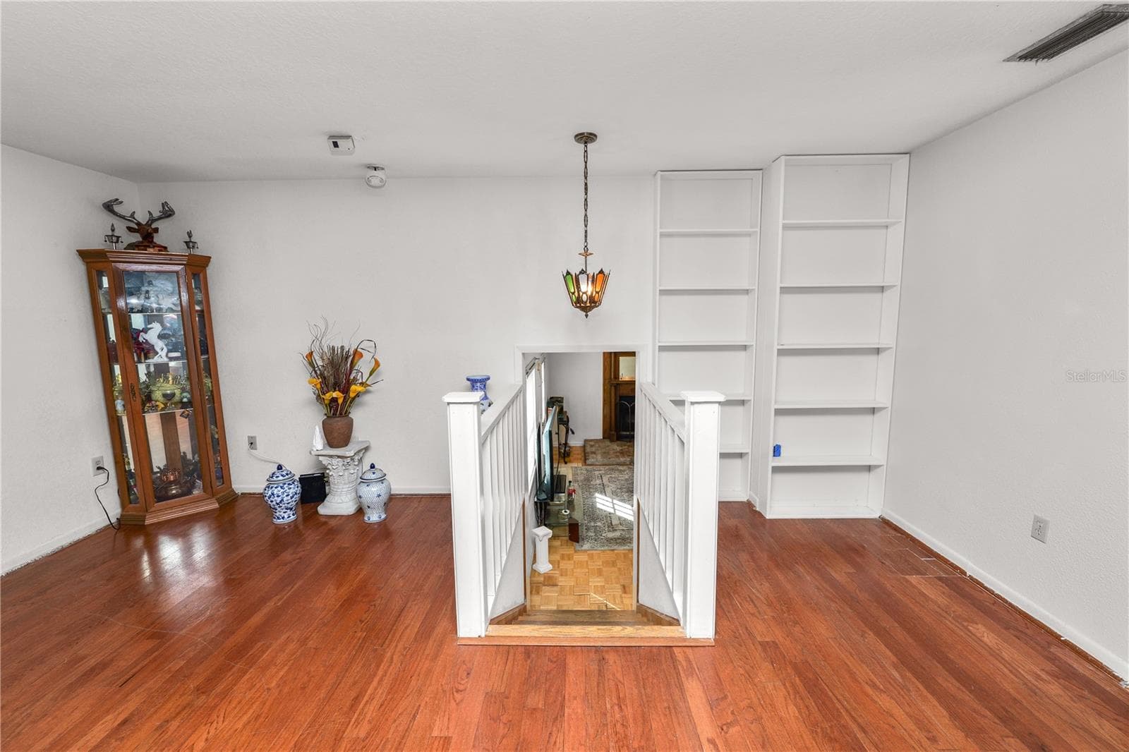 Step downstairs to Family Room and to Primary Room Suite - 109 NE 4TH AVE, MULBERRY