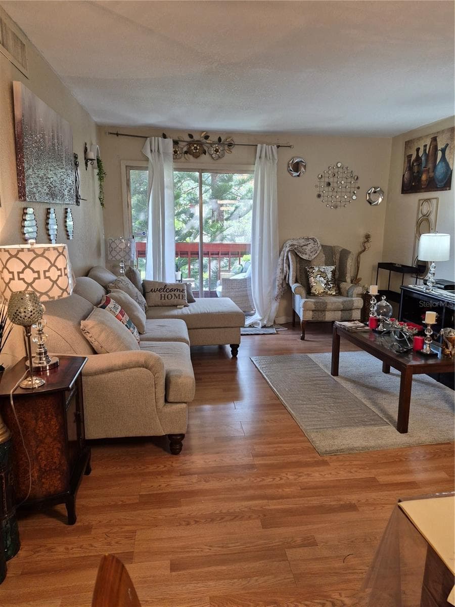 View from dining area, great room, to rear porch - ORLANDO
