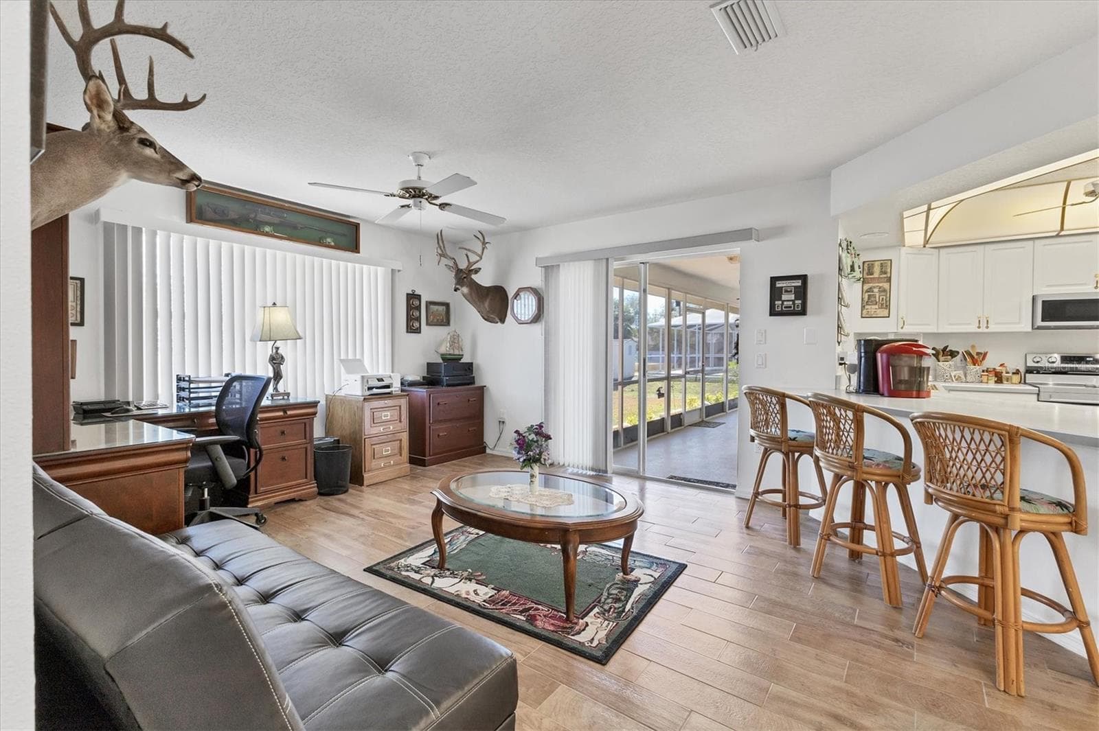 Family room with slider to lanai - 2720 S BISCAYNE DR, NORTH PORT