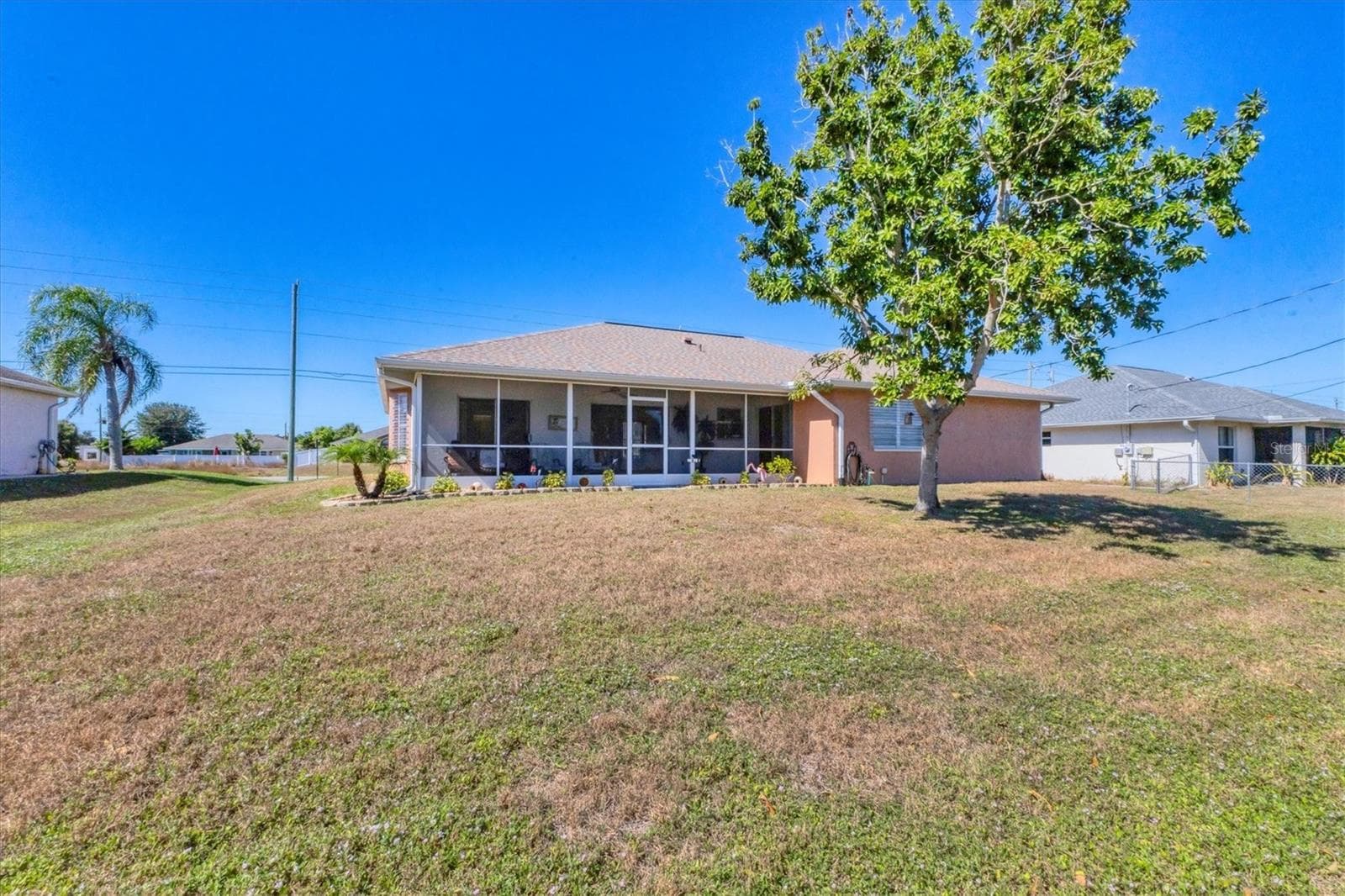 Yard, rear exterior - 2720 S BISCAYNE DR, NORTH PORT