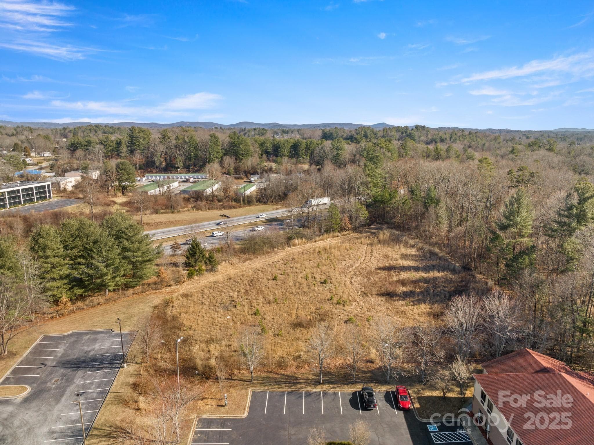 Also includes Lot D: Facing I-26, highly visible flat land ready to build. - Hendersonville