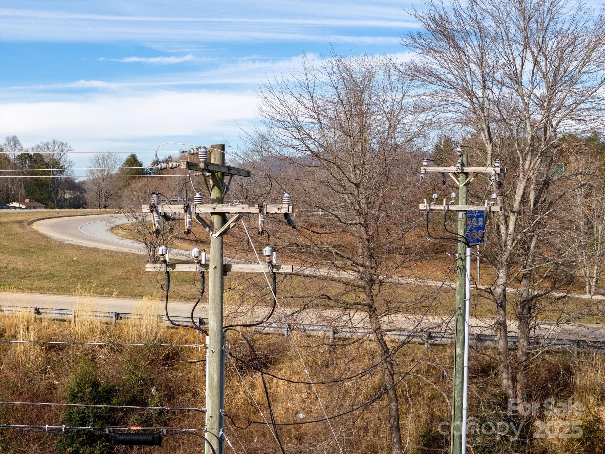 3-Phase electric to property and then goes underground. In the distance is the on-ramp for I-26 - Hendersonville