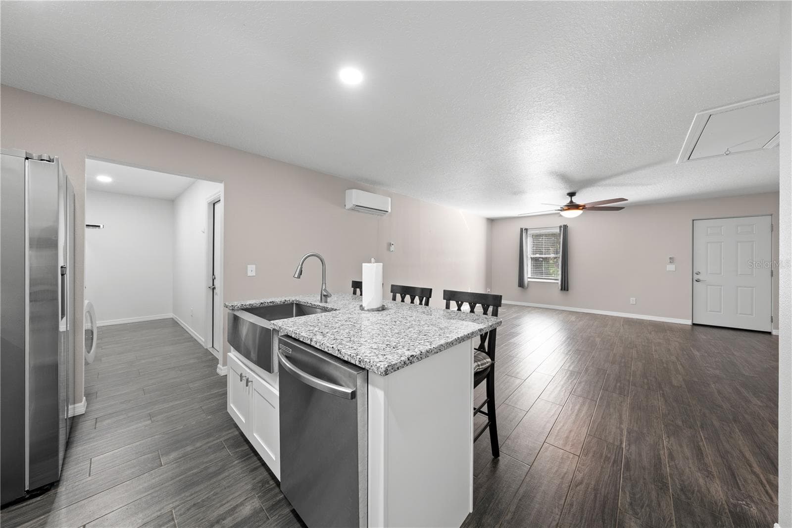 In-law suite kitchen island with farm sink, dishwasher and breakfast bar. - 4055 EDSEL AVE, ST CLOUD