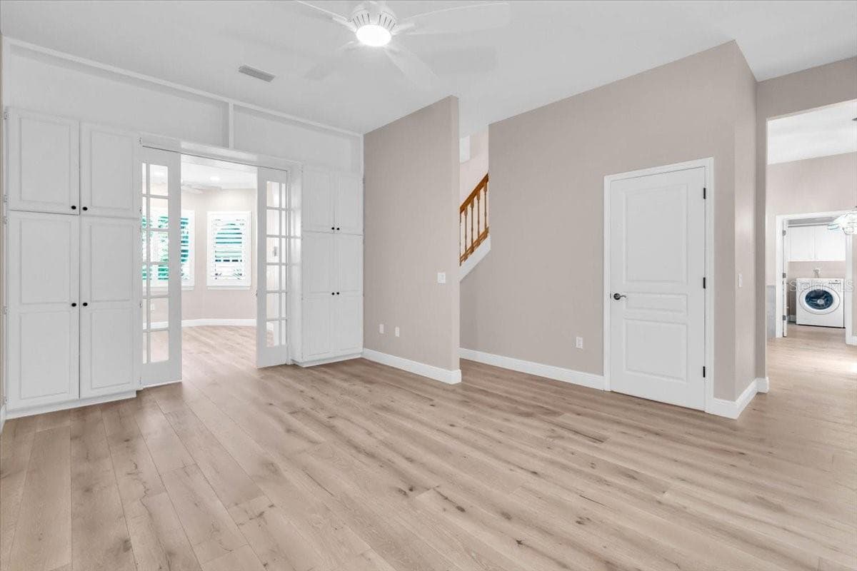 Living room with a view of the office/den and laundry room - 2306 64TH ST W, BRADENTON