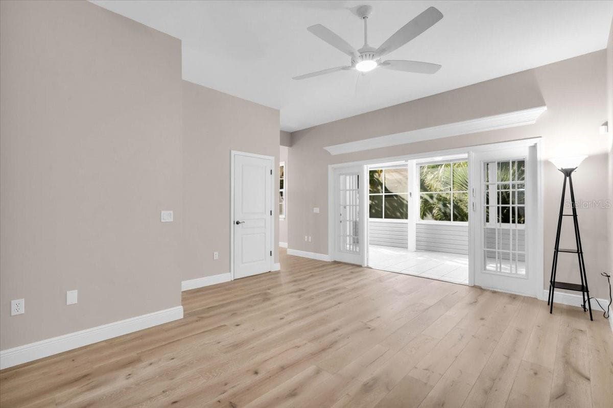 Spacious living room the flows on to air conditioned sunroom - 2306 64TH ST W, BRADENTON