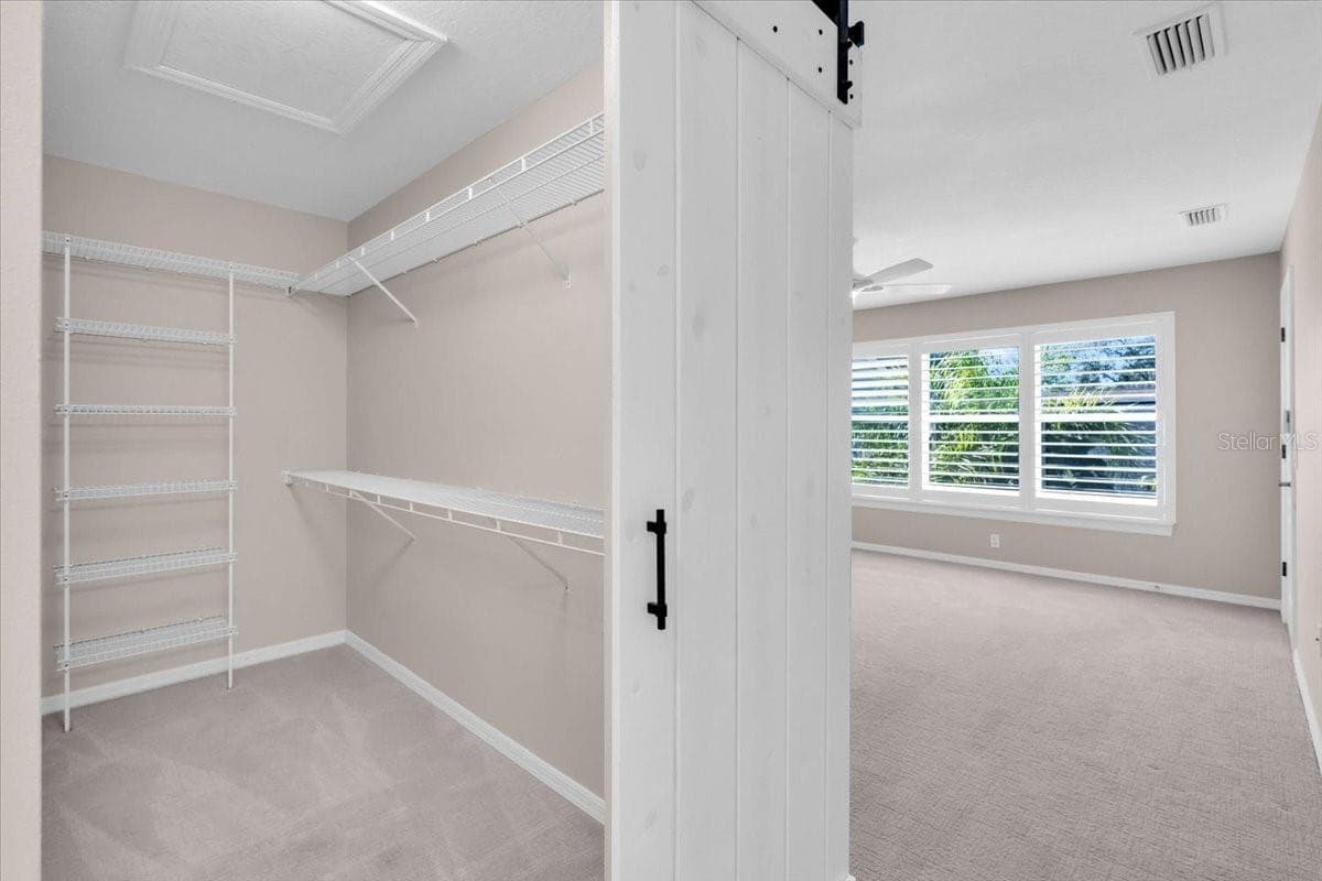 Master closet with plenty of storage and crawl space access - 2306 64TH ST W, BRADENTON