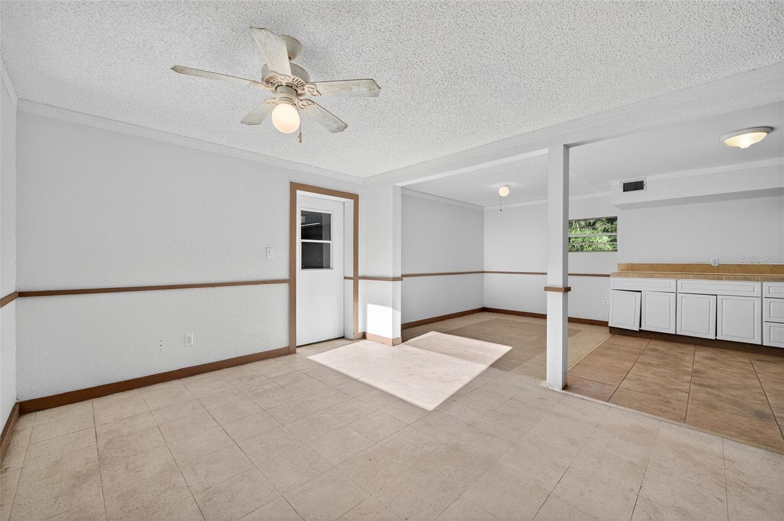 First level view of the kitchen, dining & living rooms. - 6345 LOST TRL, HOLIDAY