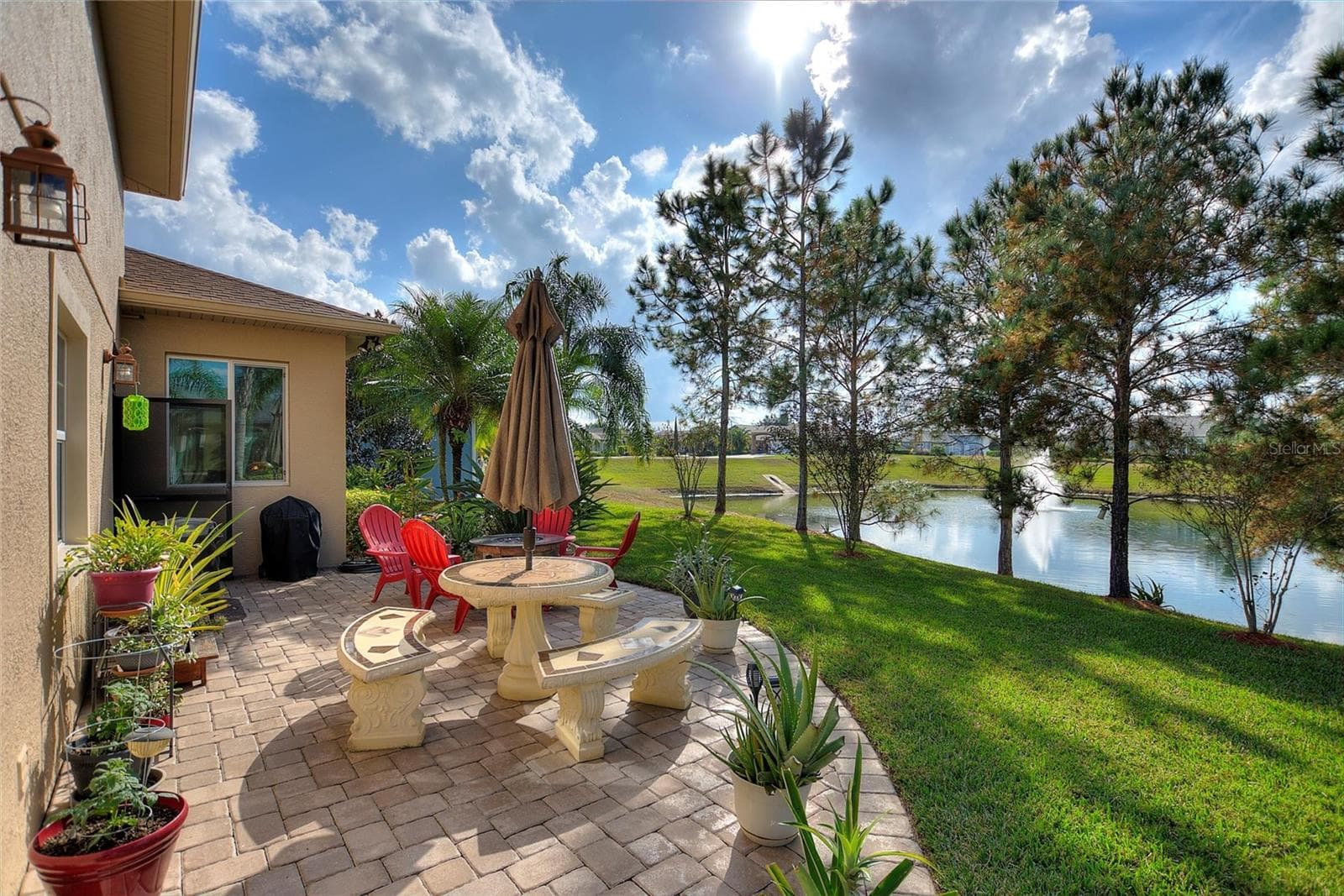 Beautiful back yard patio overlooking the pond - 548 NARROW POND RD, POLK CITY