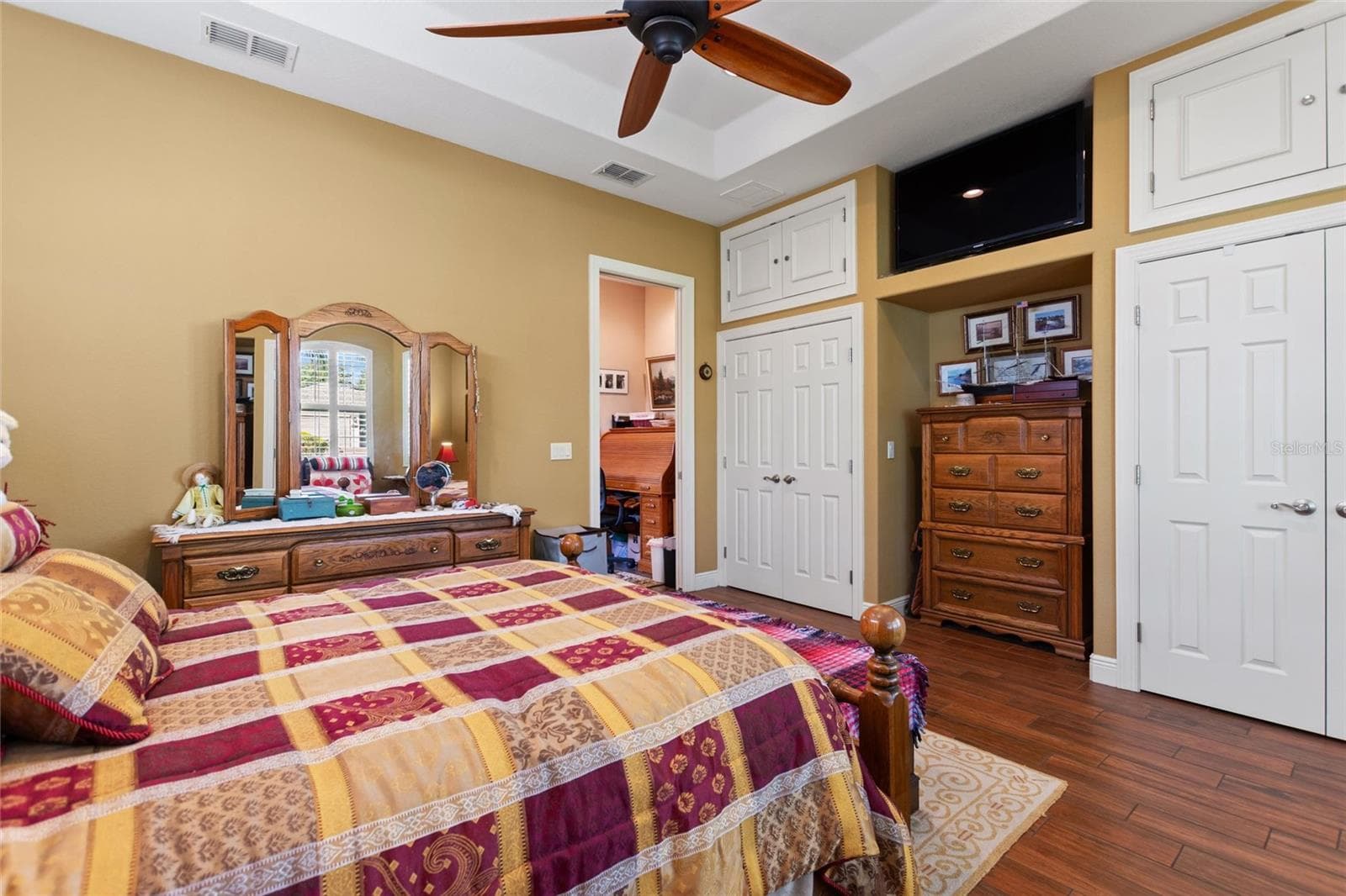 Primary bedroom dual closets with storage above. - 548 NARROW POND RD, POLK CITY
