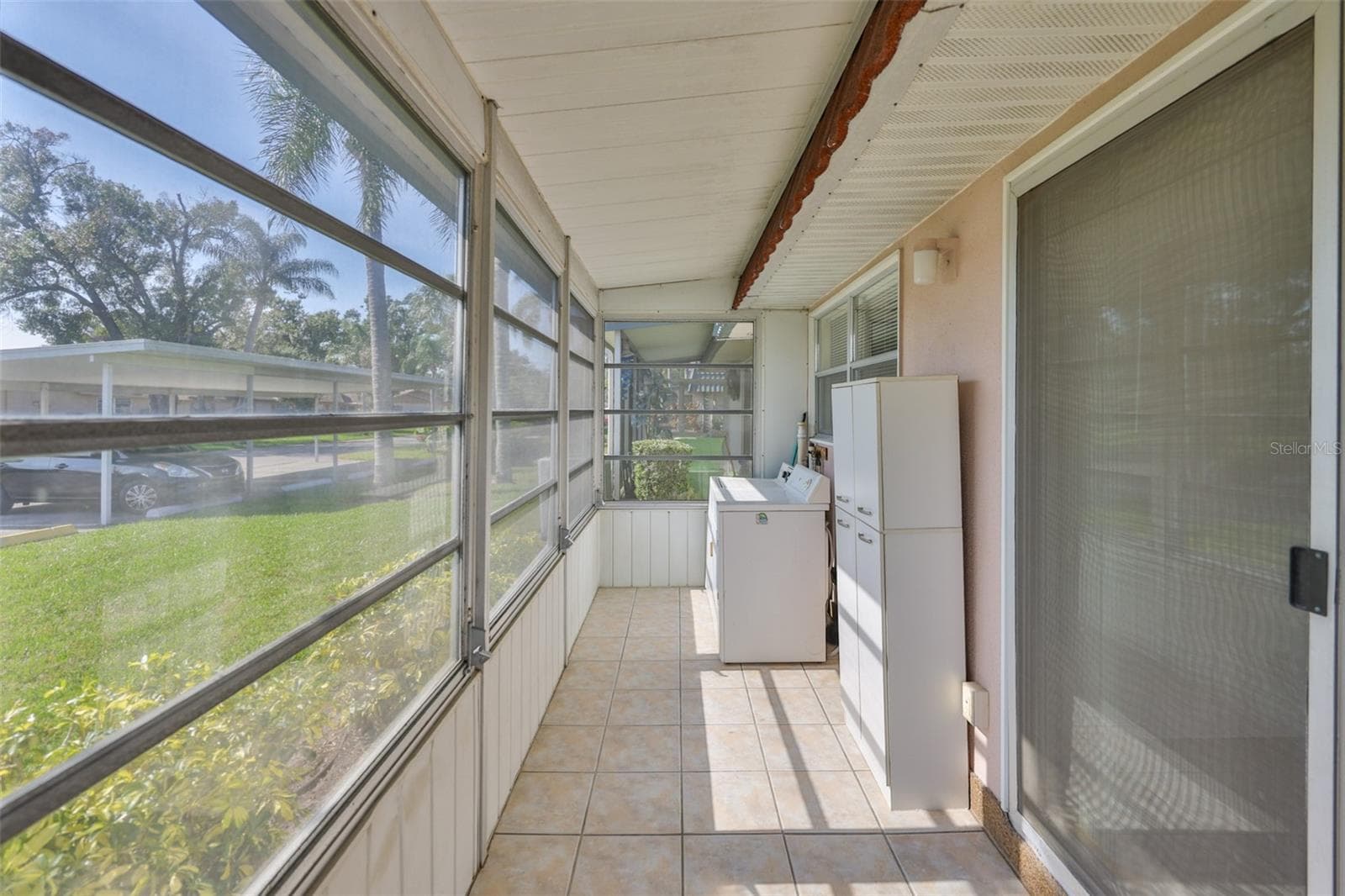Florida Room with washer and dryer, rear door - 1811 BEDFORD LN #153, SUN CITY CENTER