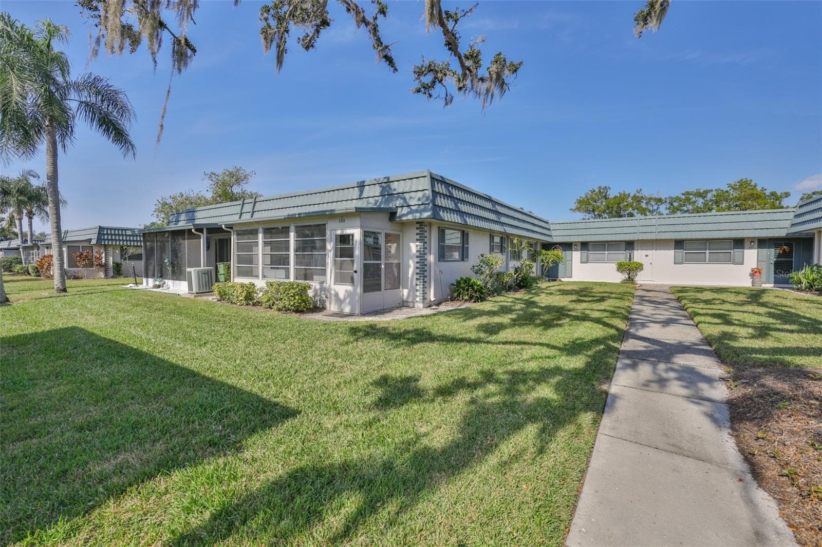 Florida Room and rear door, golf cart doors - just steps from the covered carport - 1811 BEDFORD LN #153, SUN CITY CENTER